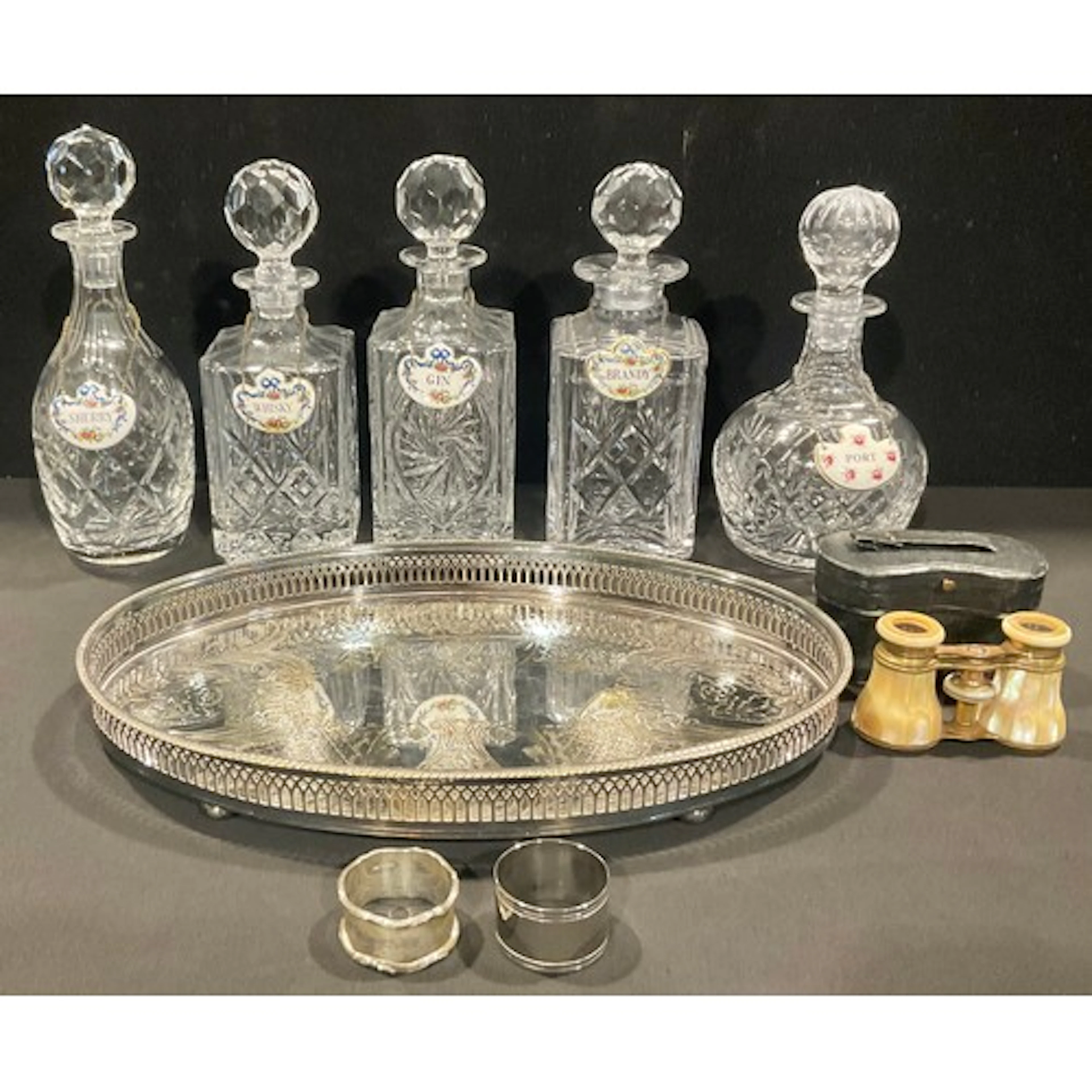 A collection of six cut glass decanters, various shapes; a s...