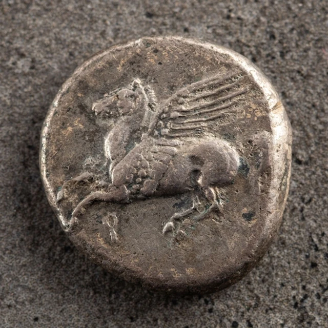 An Ancient Greek Corinthian Stater coin. Having Peguses to t...