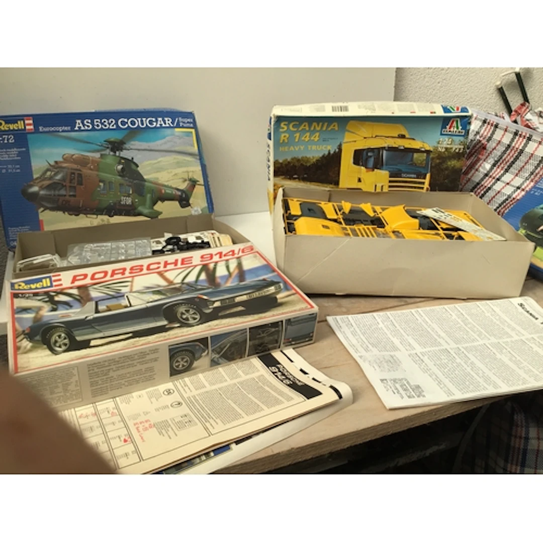 A bag containing a collection of boxed model kits by manufac...