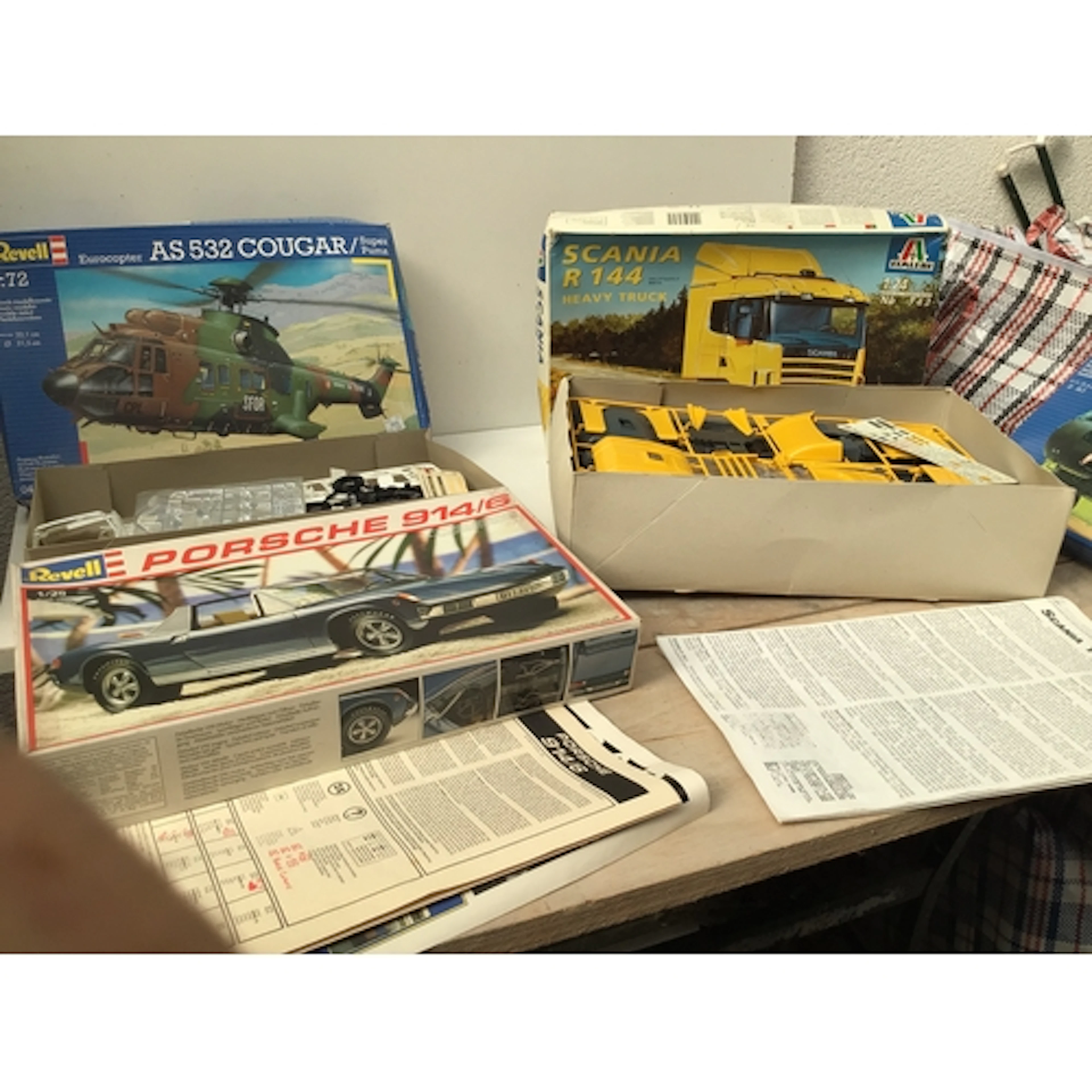 A bag containing a collection of boxed model kits by manufac...