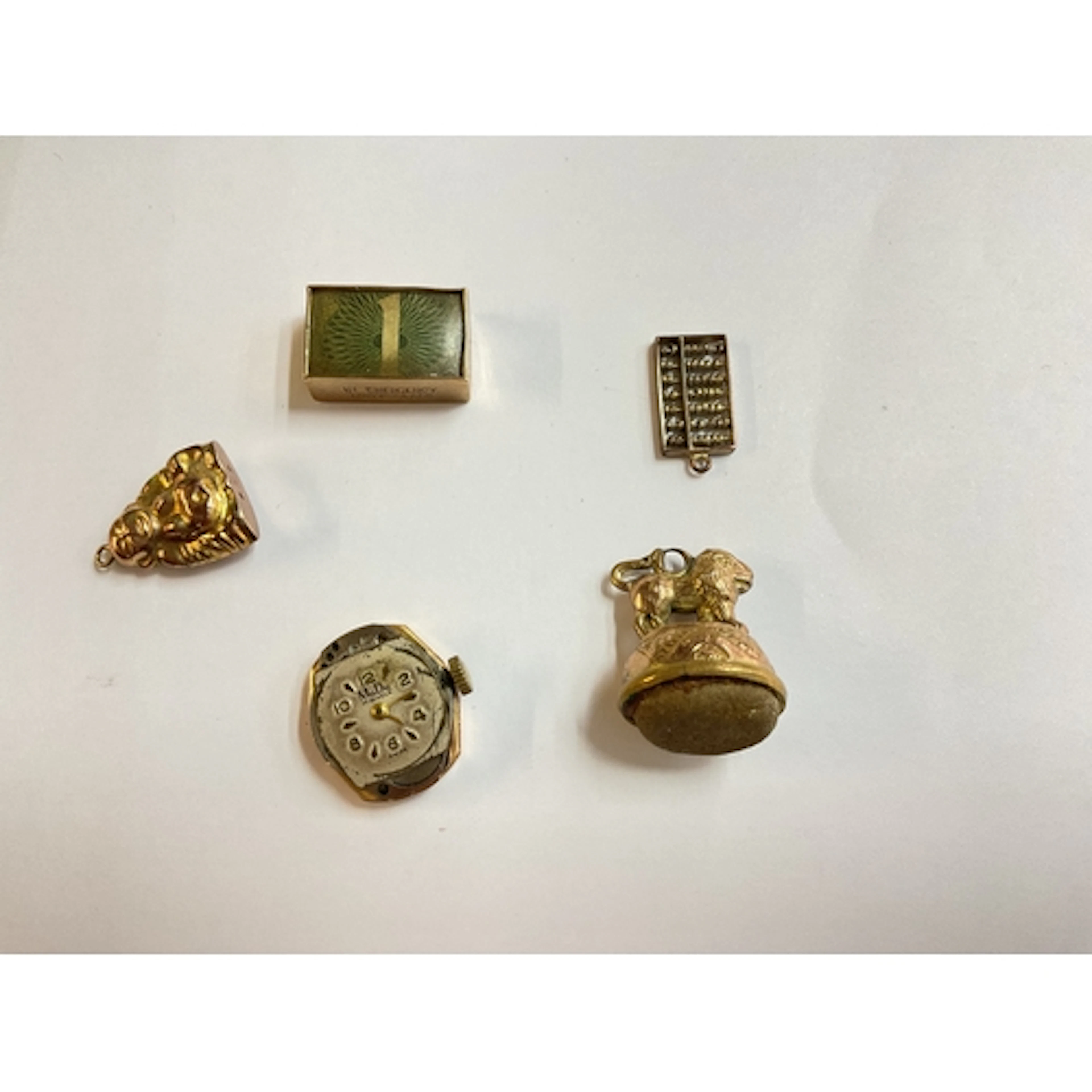 4 9ct fobs and mudu watch in 18ct case
