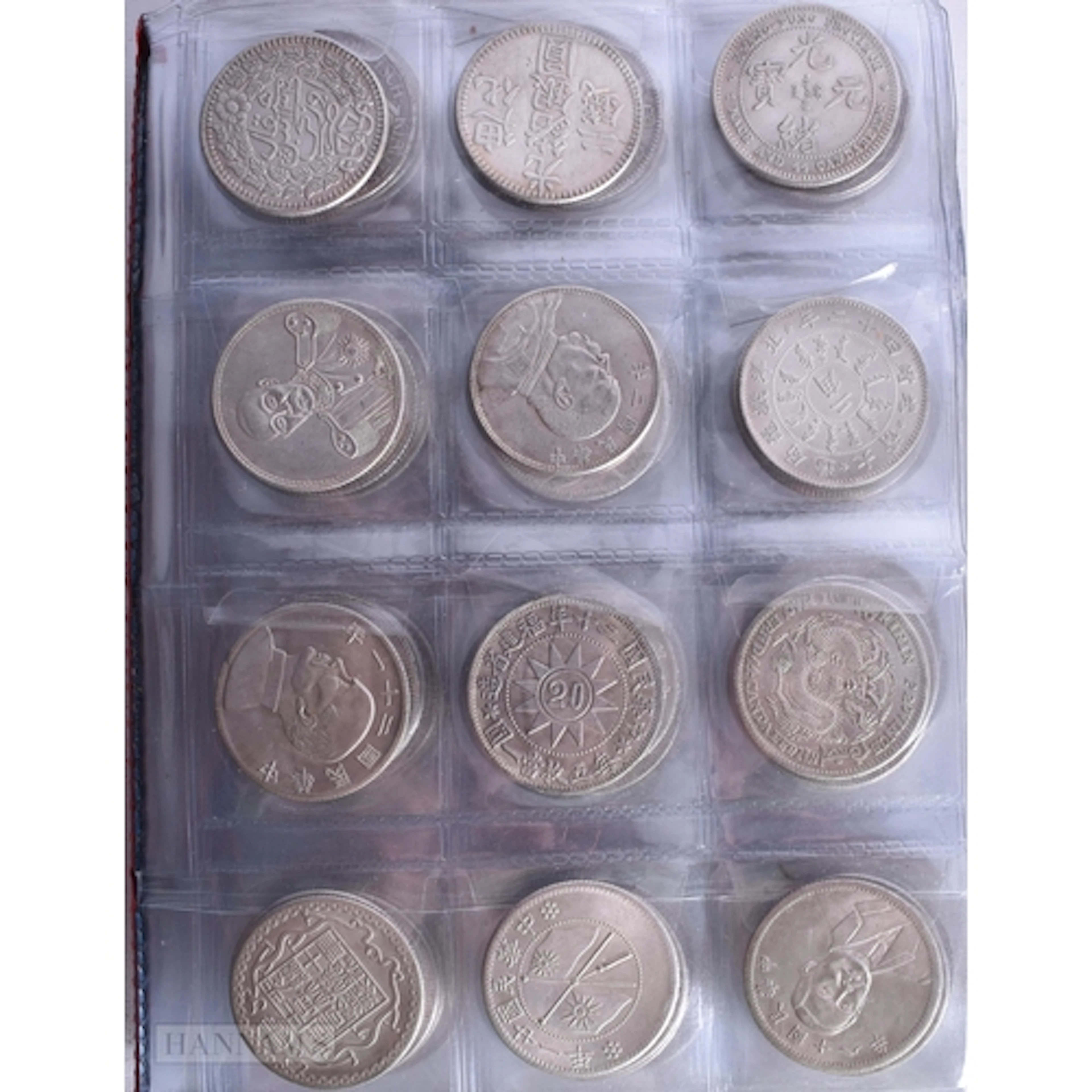 A CHINESE BOOK OF COINS. 2.5 cm diameter. approx 640 grams