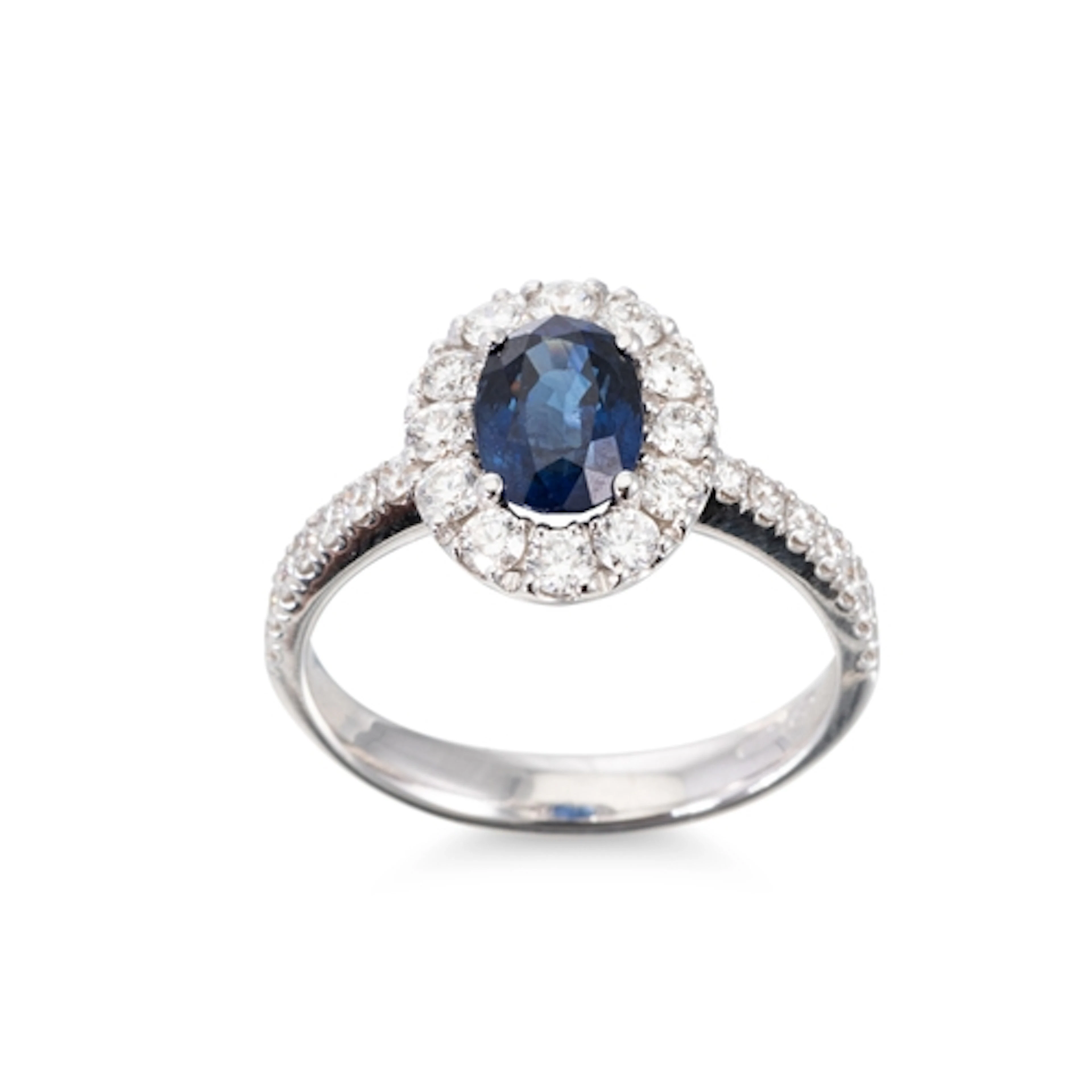 A SAPPHIRE AND DIAMOND CLUSTER RING, the central oval cut sa...