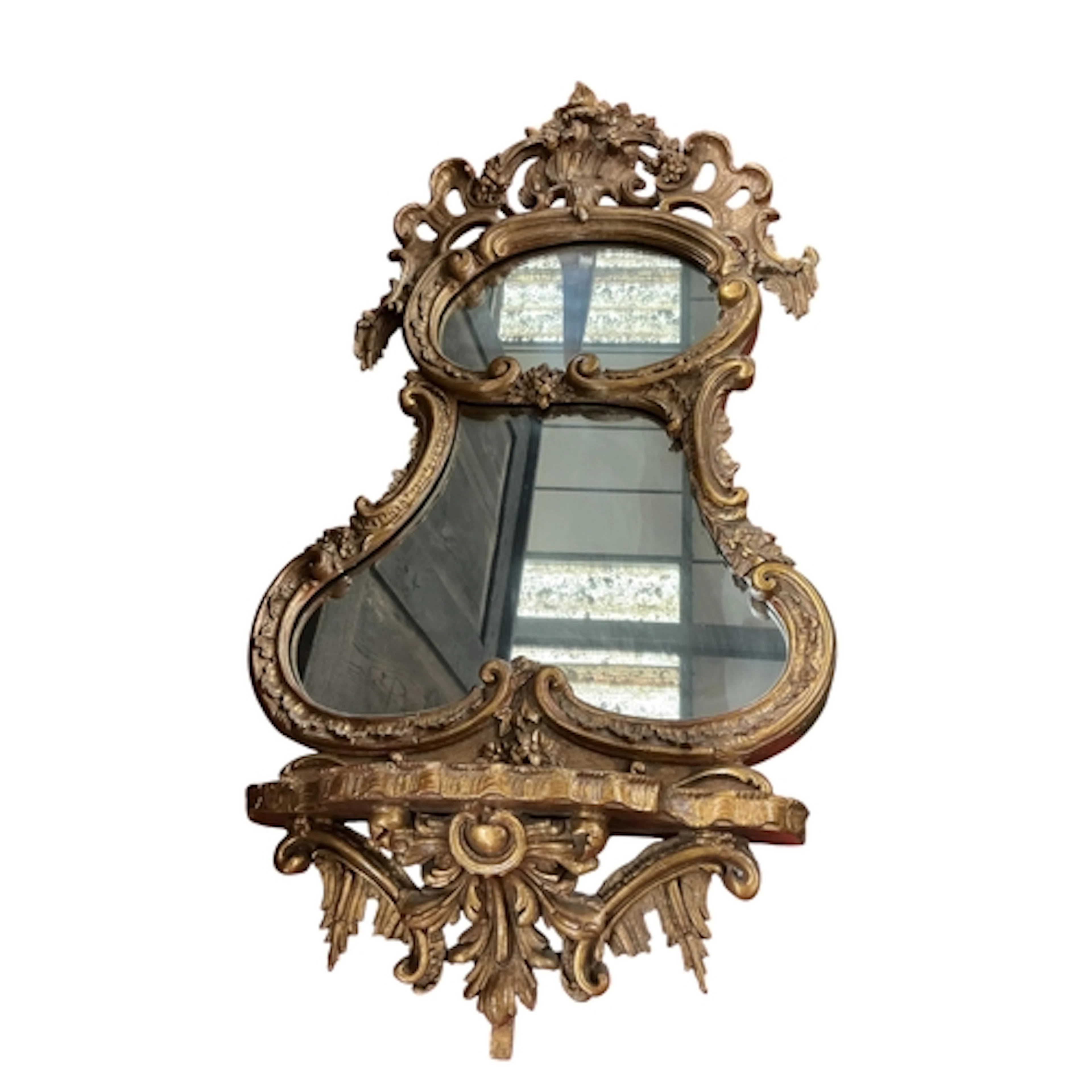 A 19th century Rococo Revival giltwood mirror with bracket s...