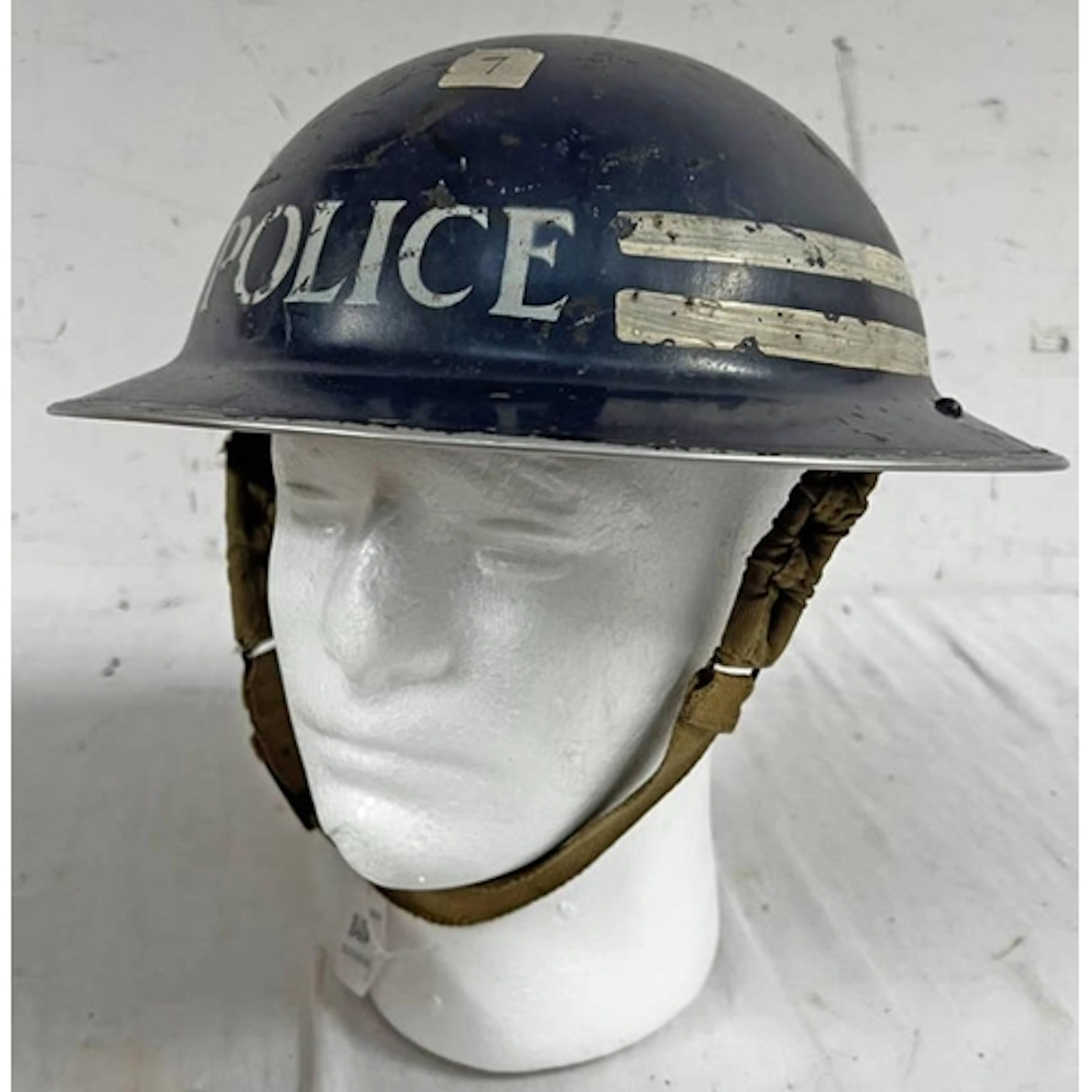 WW2 BRITISH BRODIE HELMET MARKED POLICE TO EXTERIOR AND STAM...