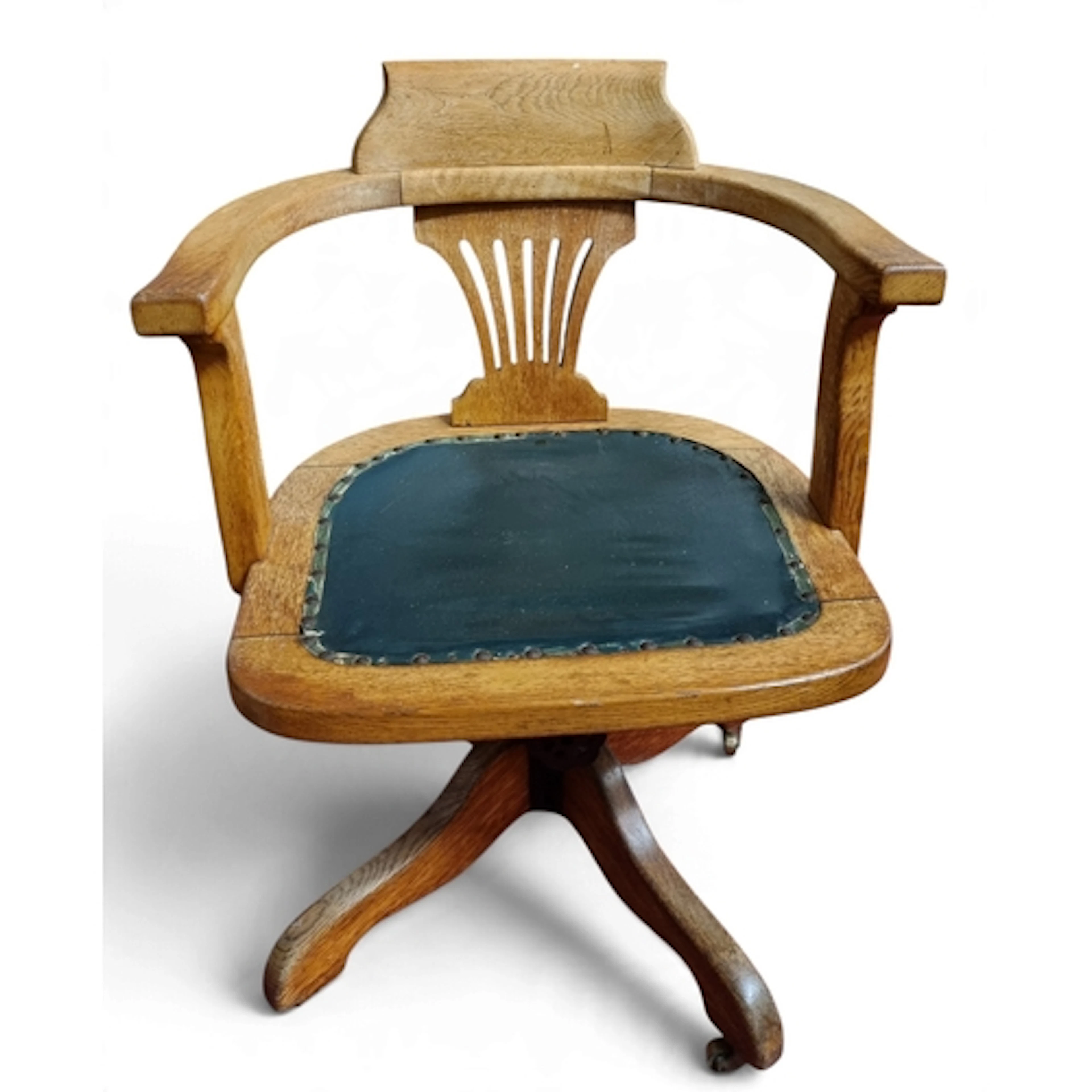 A late 19th Century Oak revolving Desk Chair with leather up...