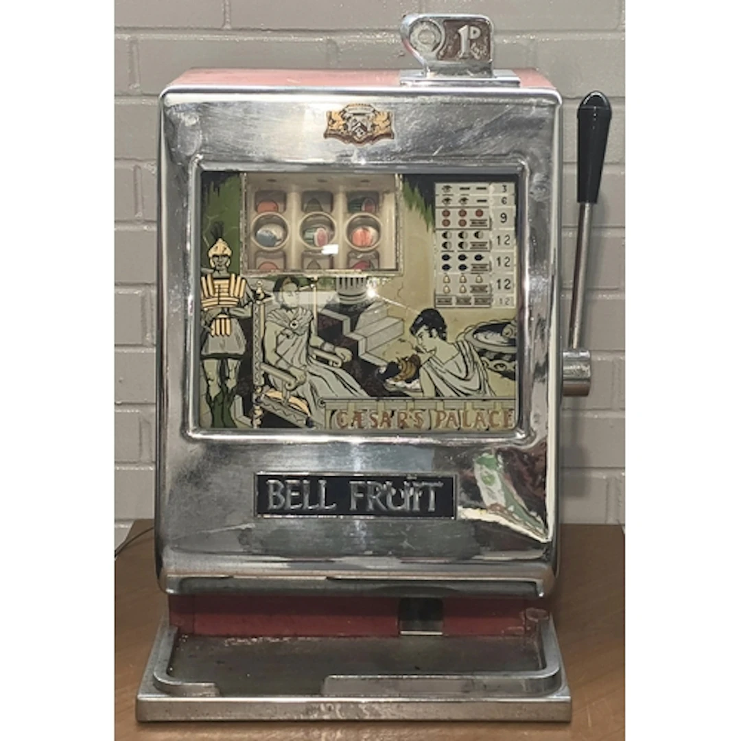 A vintage 1960's Bell Fruit Caesar's Palace slot machine wit...