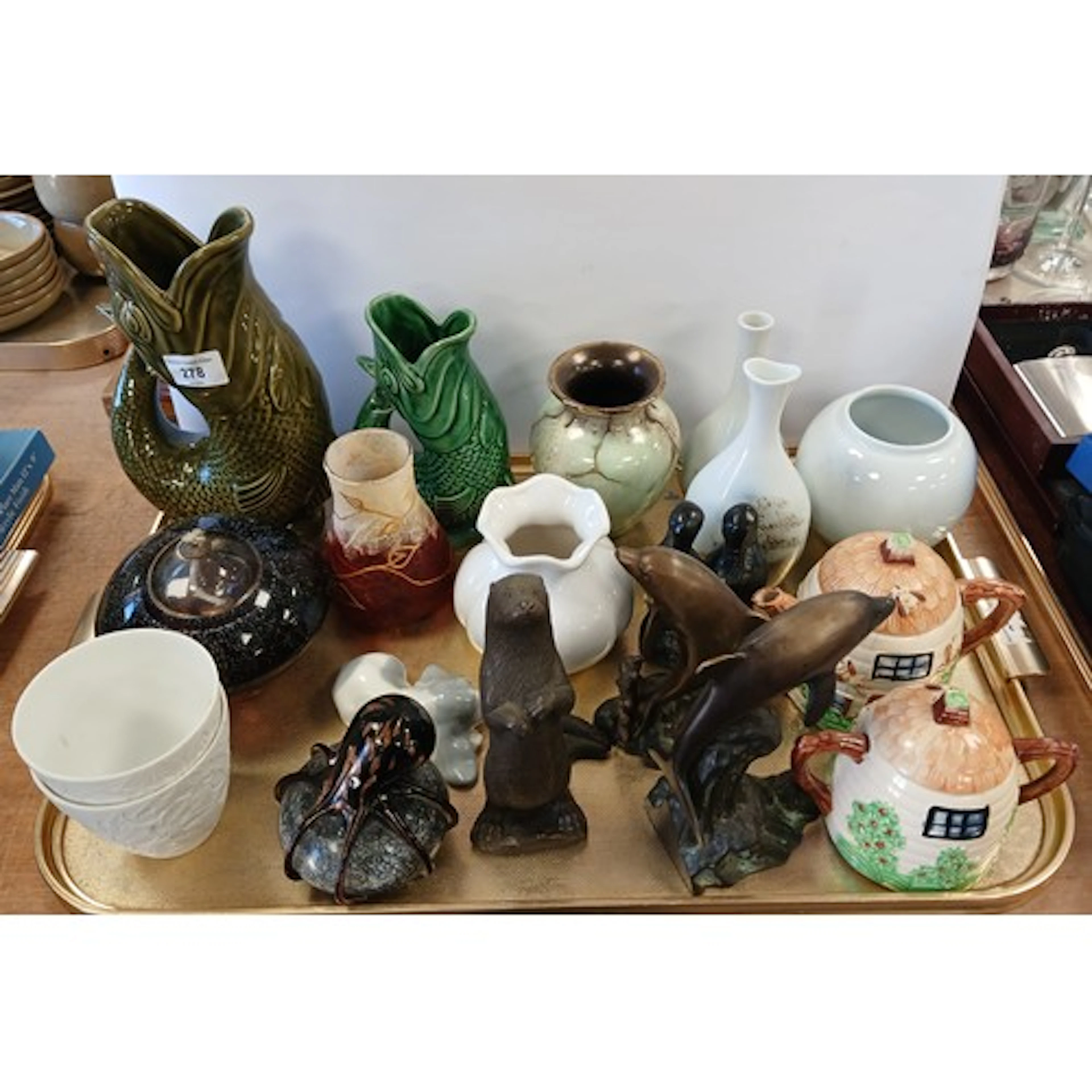 Two Dartmouth fish jugs, two cast dolphins, Octopus paperwei...