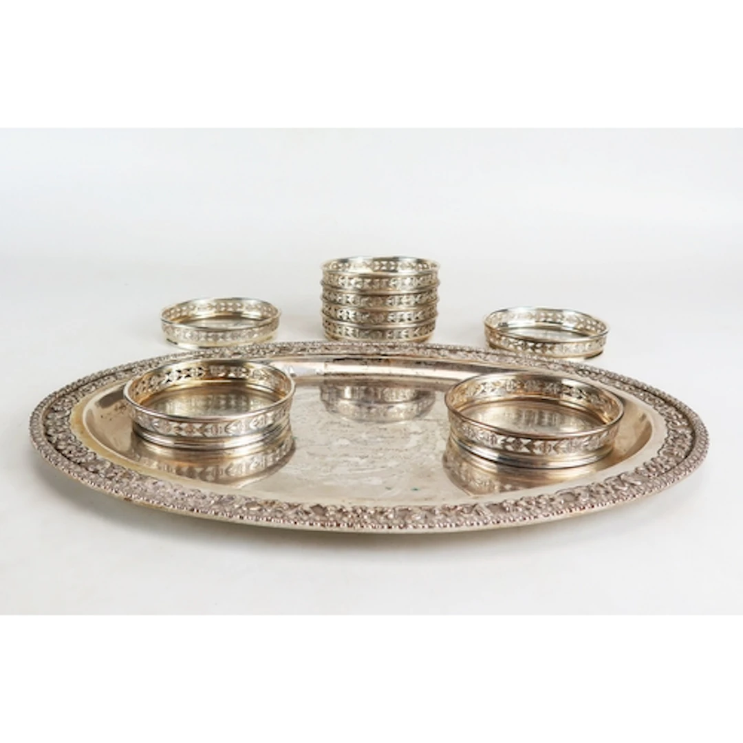 A set of eight sterling silver and glass circular coasters, ...