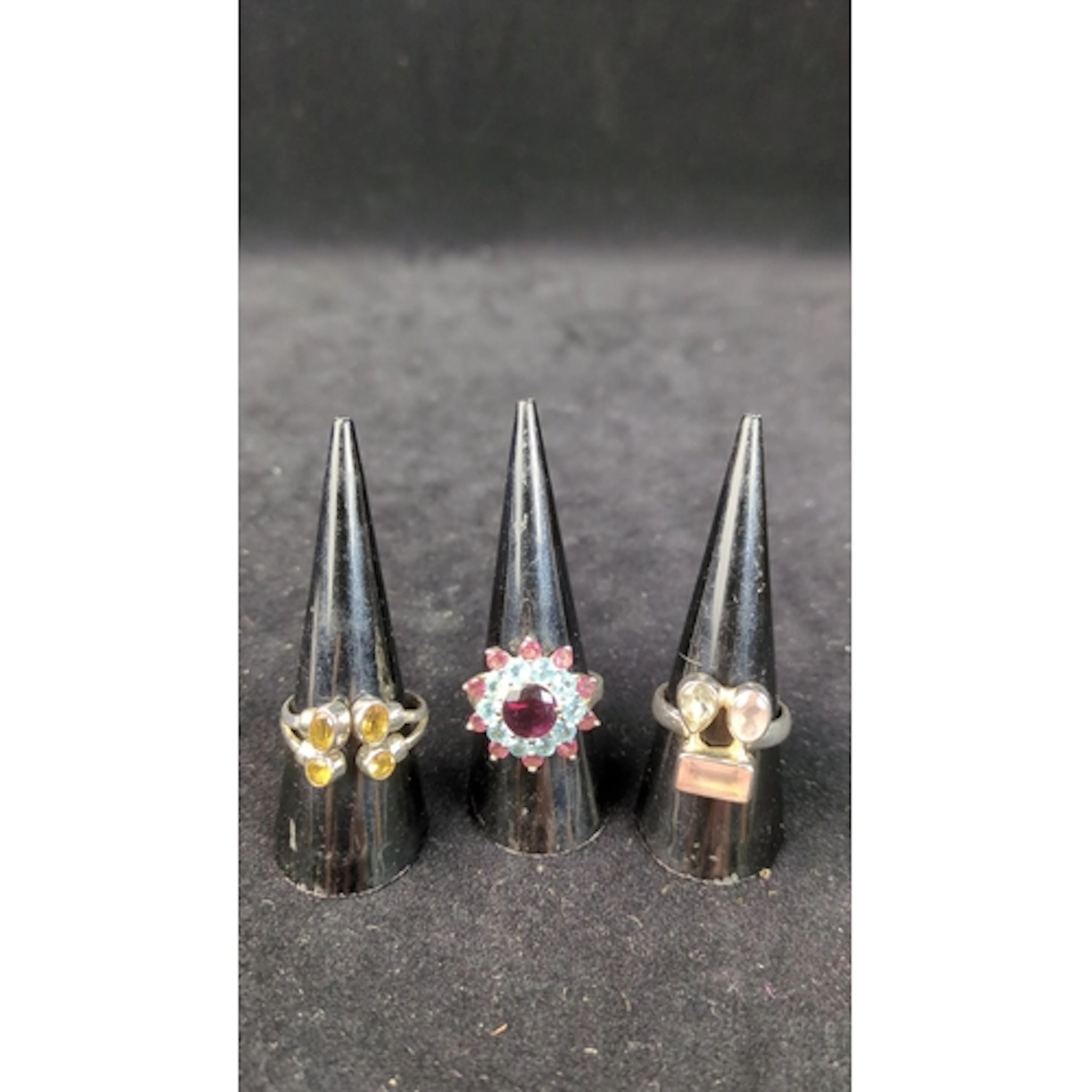 Three sterling silver dress rings, stamped 925: one with a p...