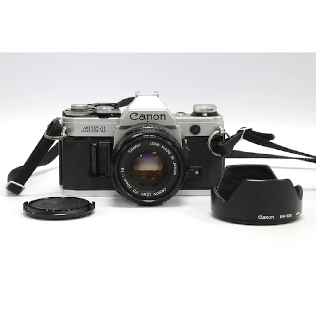Canon AE-1 35mm SLR Film Camera with attached Canon FD 50mm ...
