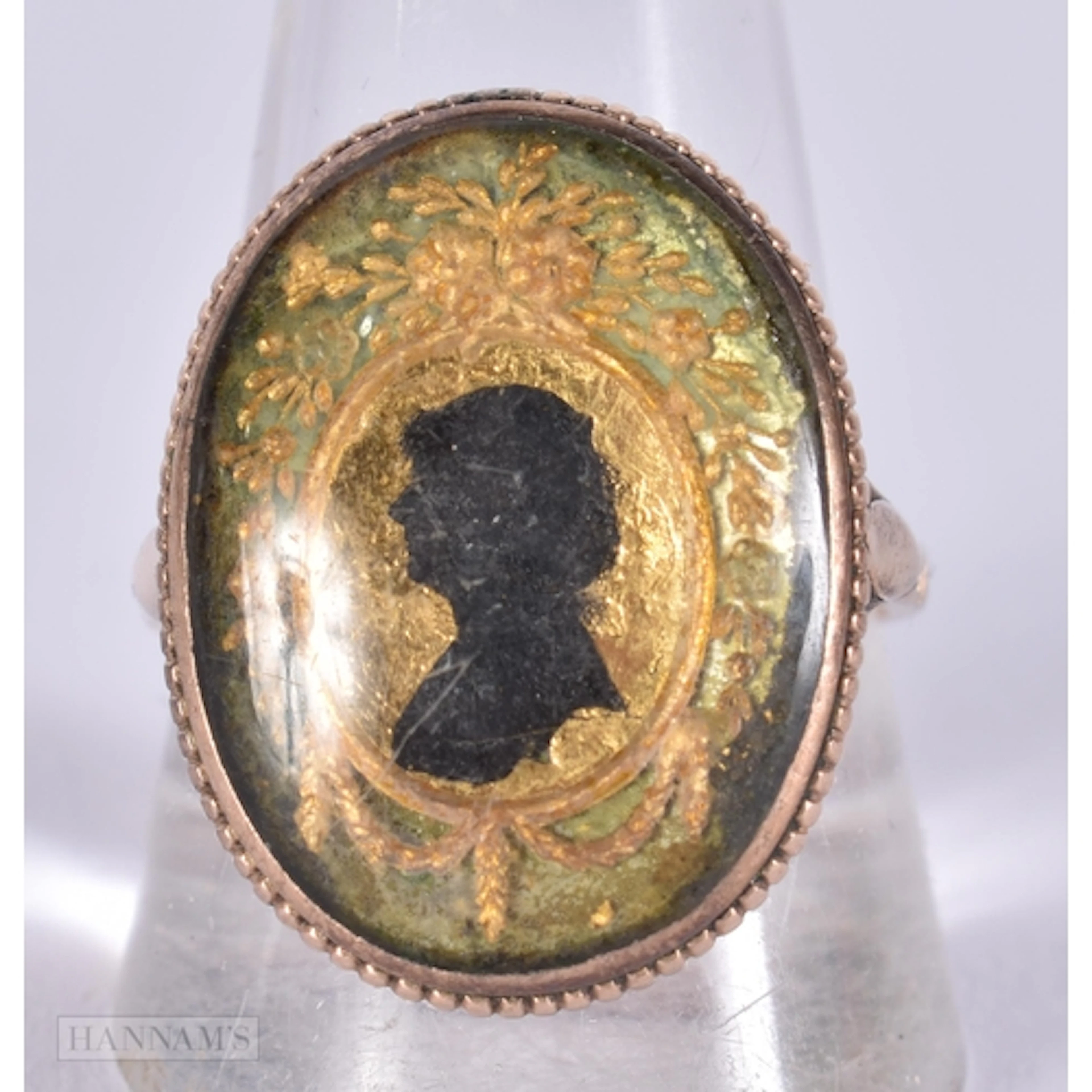 An Antique Georgian gold silhouette ring, the oval panel dep...