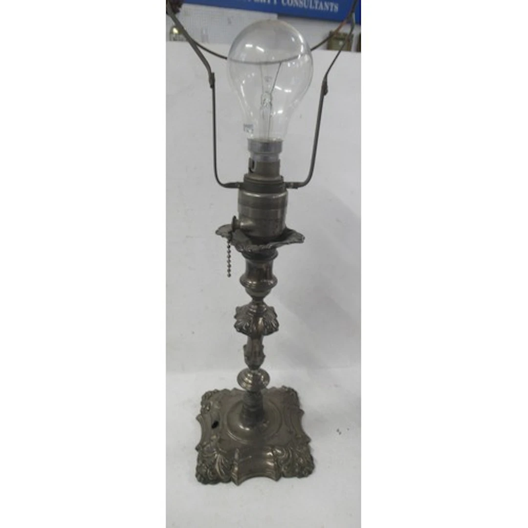 A 19th century silver candlestick, altered to make a table l...