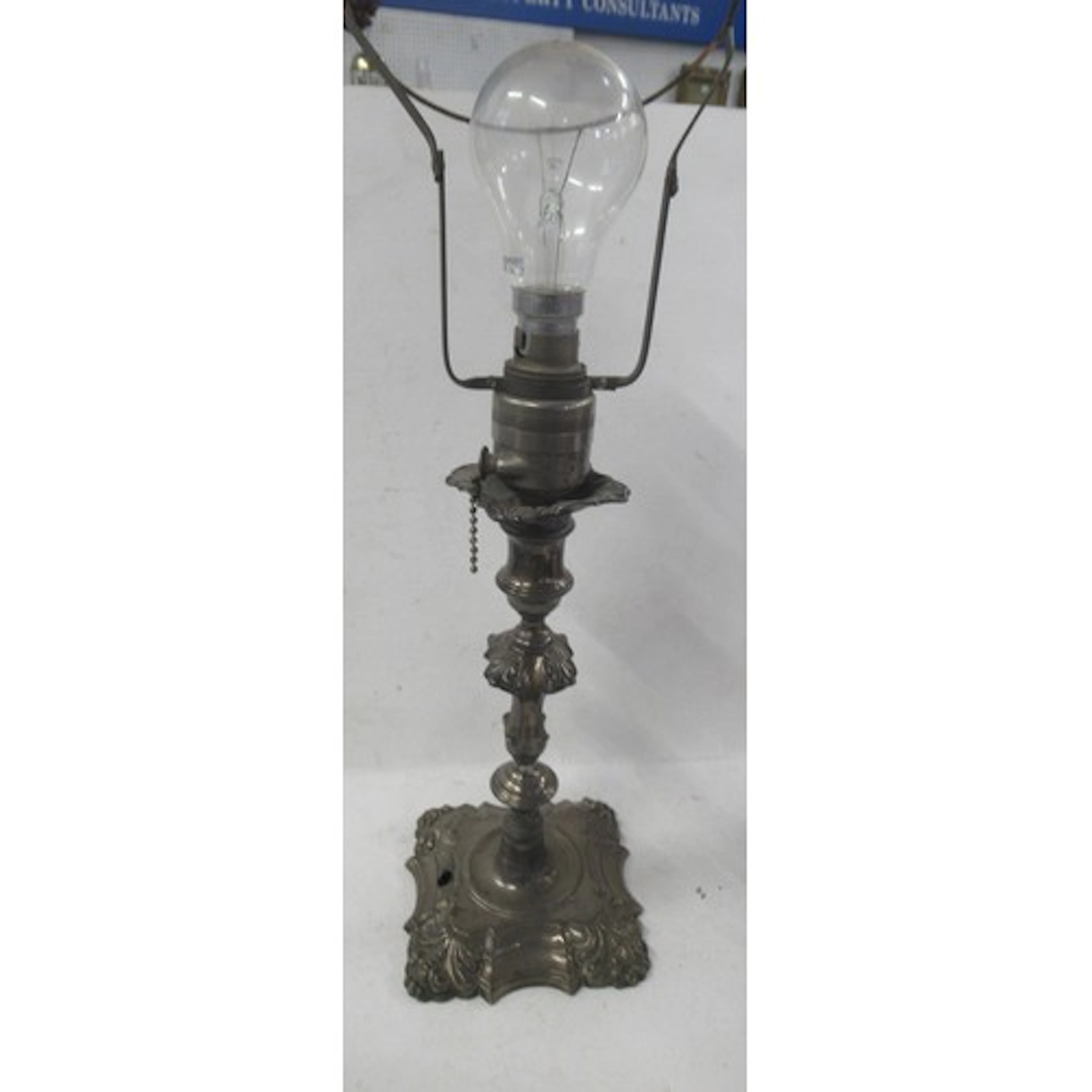 A 19th century silver candlestick, altered to make a table l...
