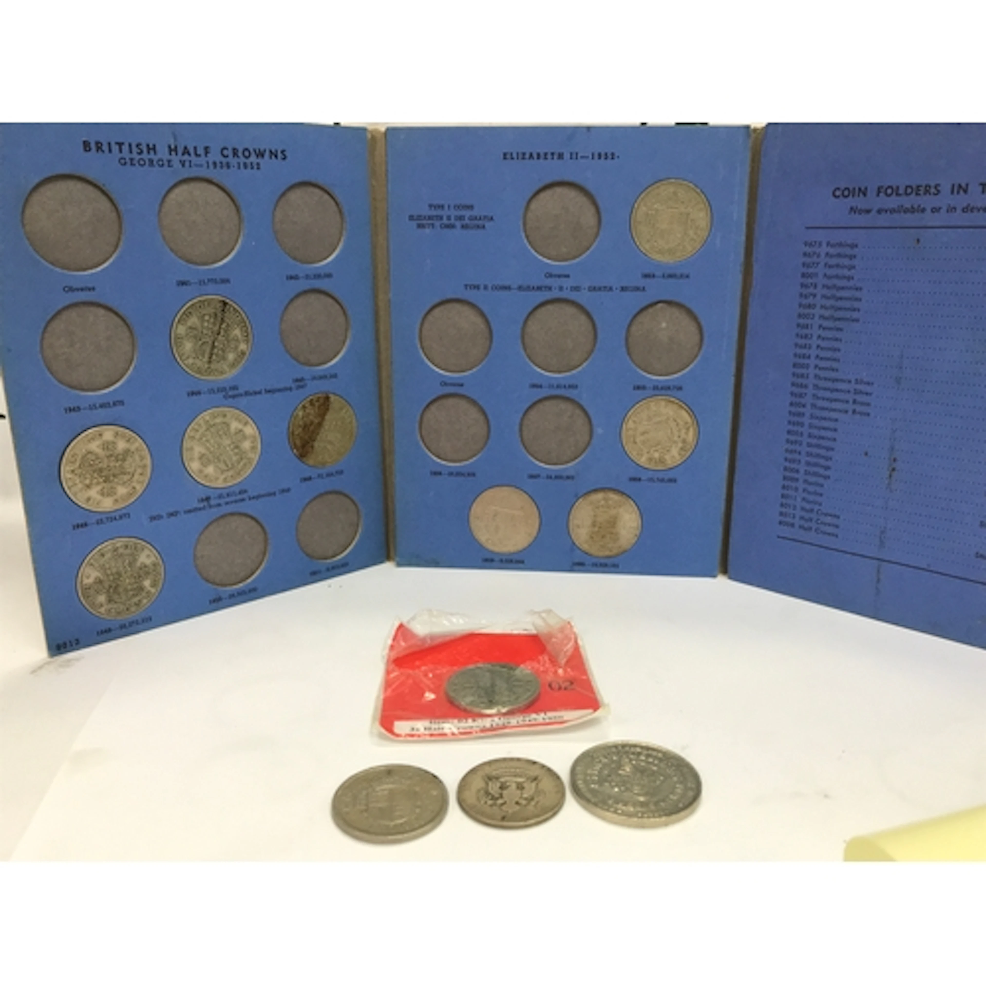 A small collection of coins including Half Crowns, Half Doll...