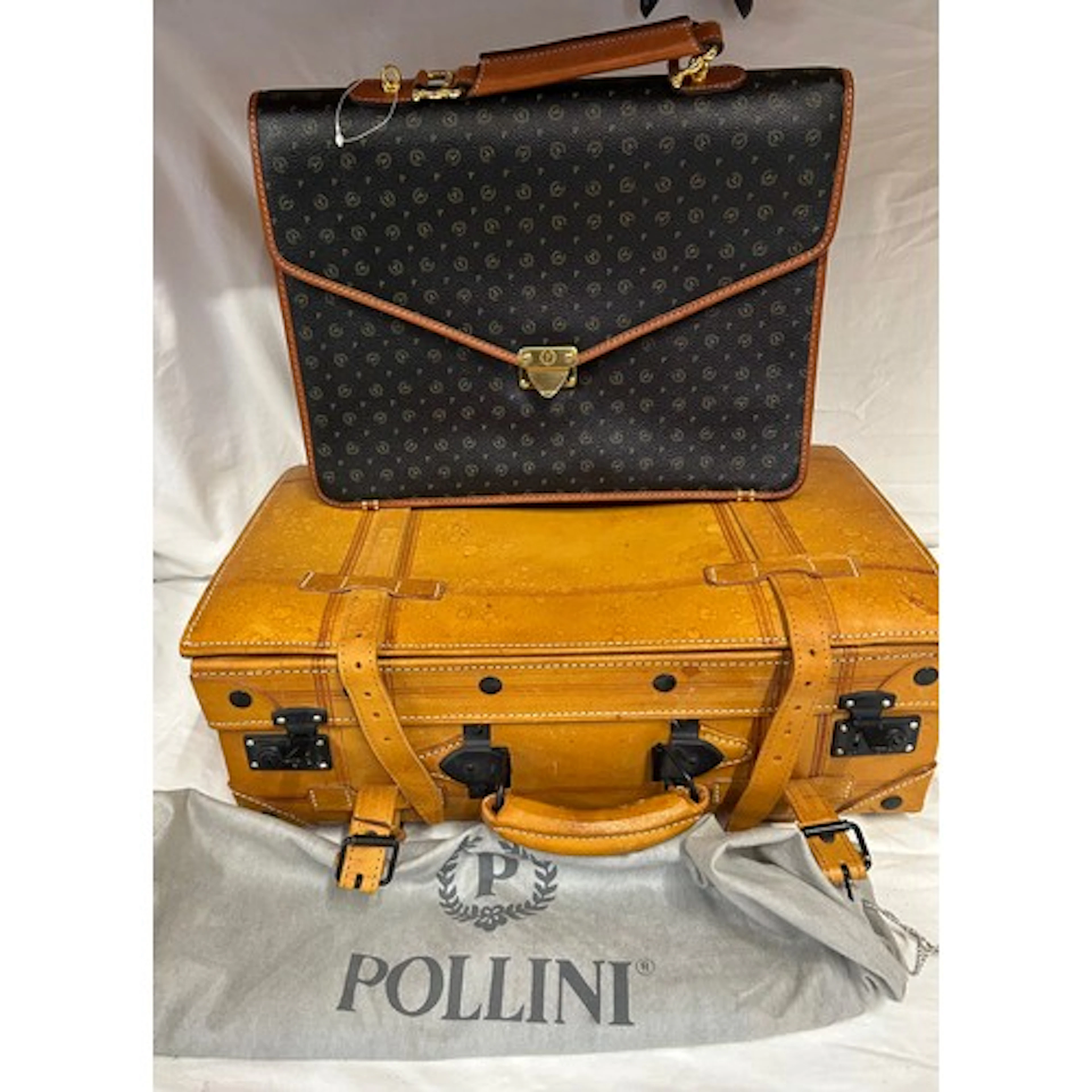 An unused Pollinini briefcase 37w x 33 h together with a sm...