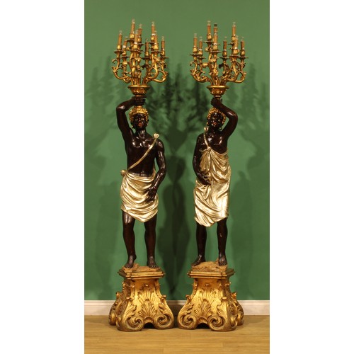 A pair of contemporary parcel ‘gilt’ and ‘silvered’ figural ...