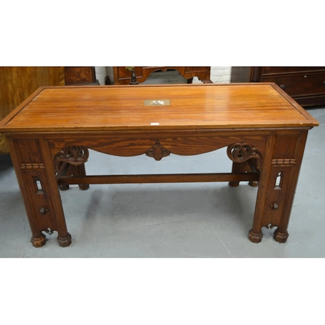 19th Century pitch pine desk / centre table, the base carved...