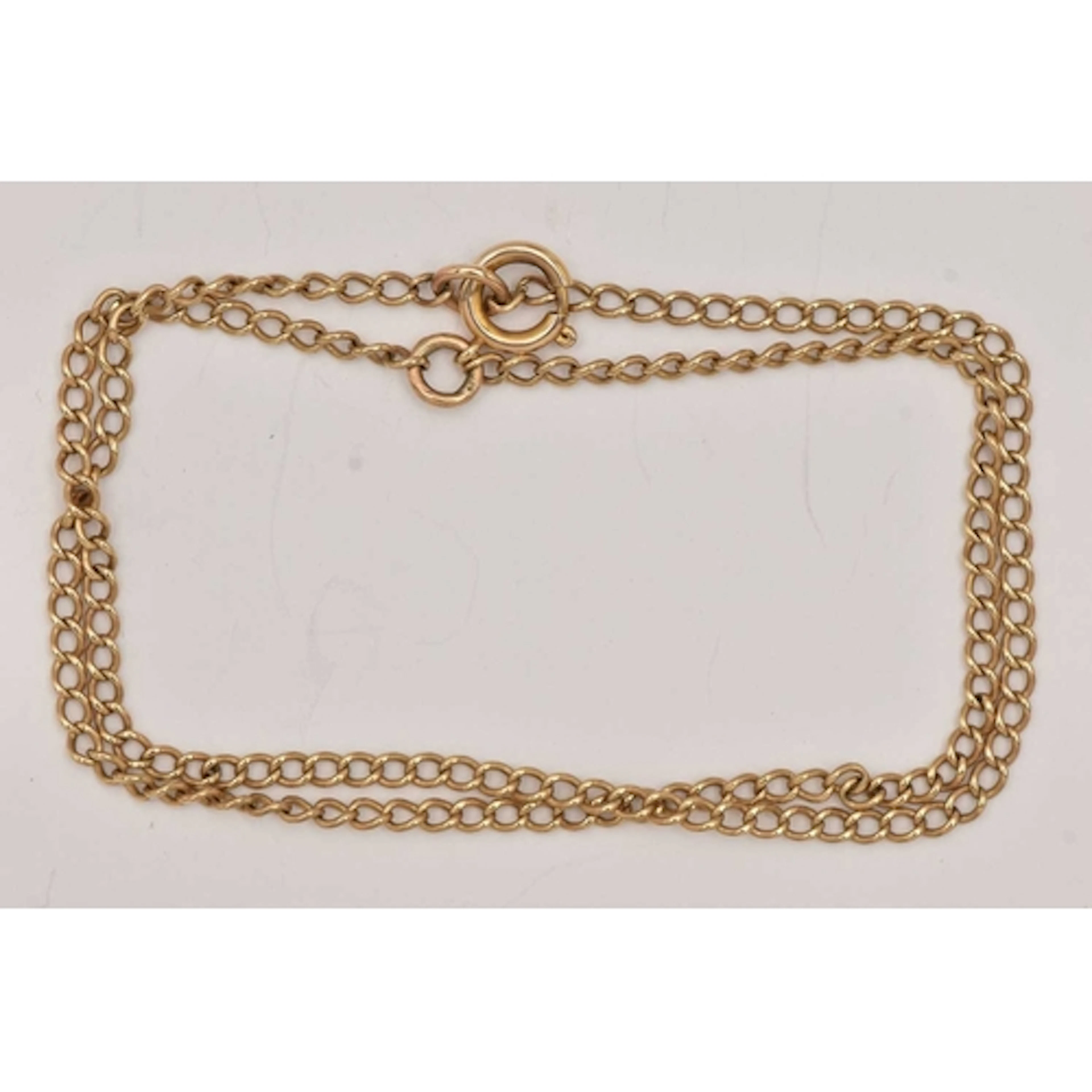 A YELLOW METAL DOUBLE CHAIN BRACELET, two fine curb link cha...