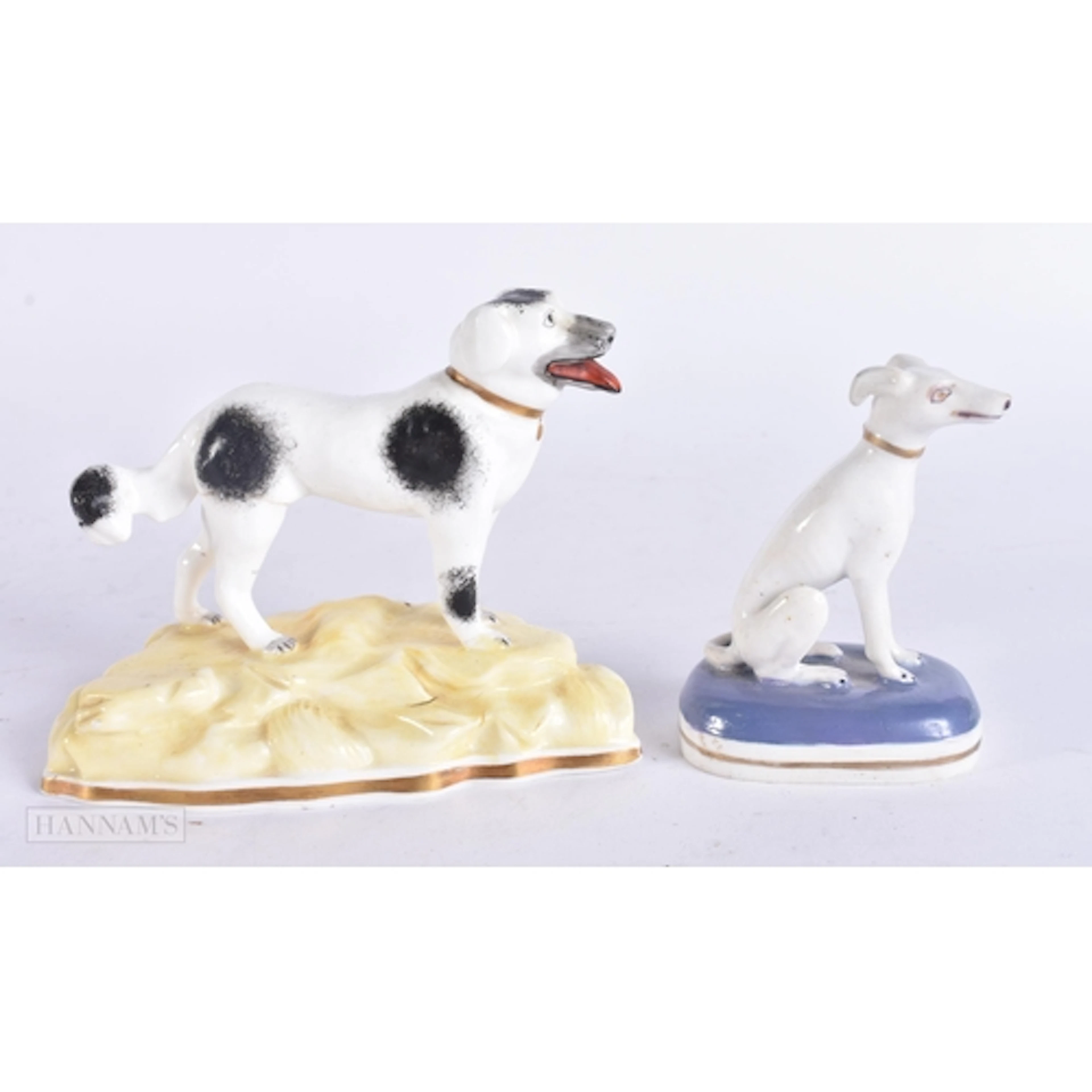 TWO 19TH CENTURY STAFFORDSHIRE DOGS. Largest 10 cm wide. (2)