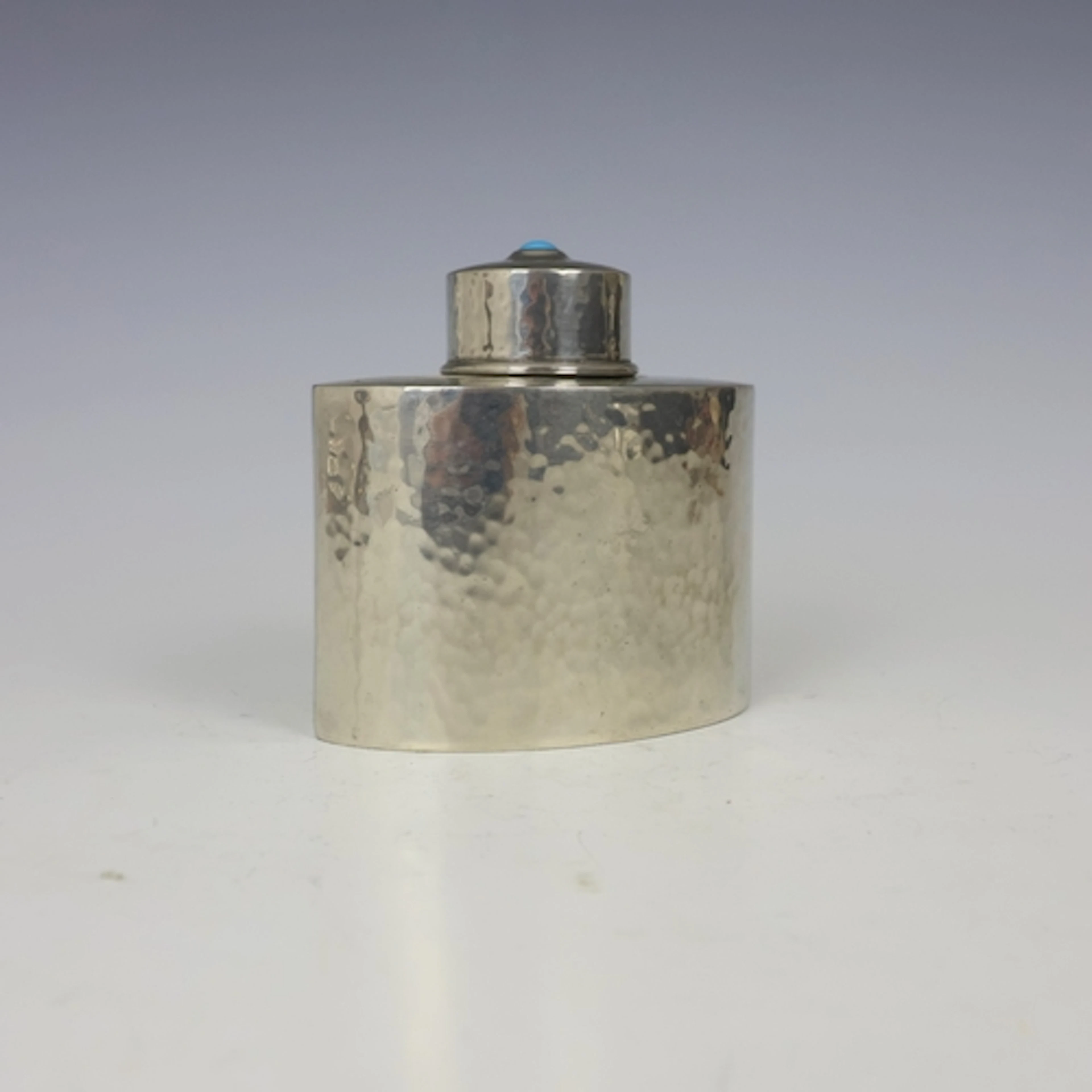 An Arts and Crafts pewter tea caddy, probably Archibald Knox...