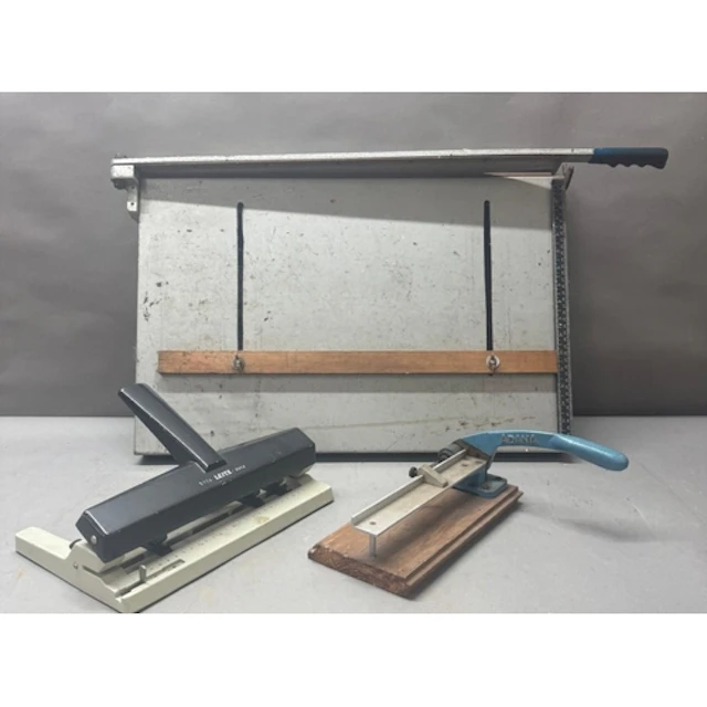 A portable drafting board with attached guillotine and two o...