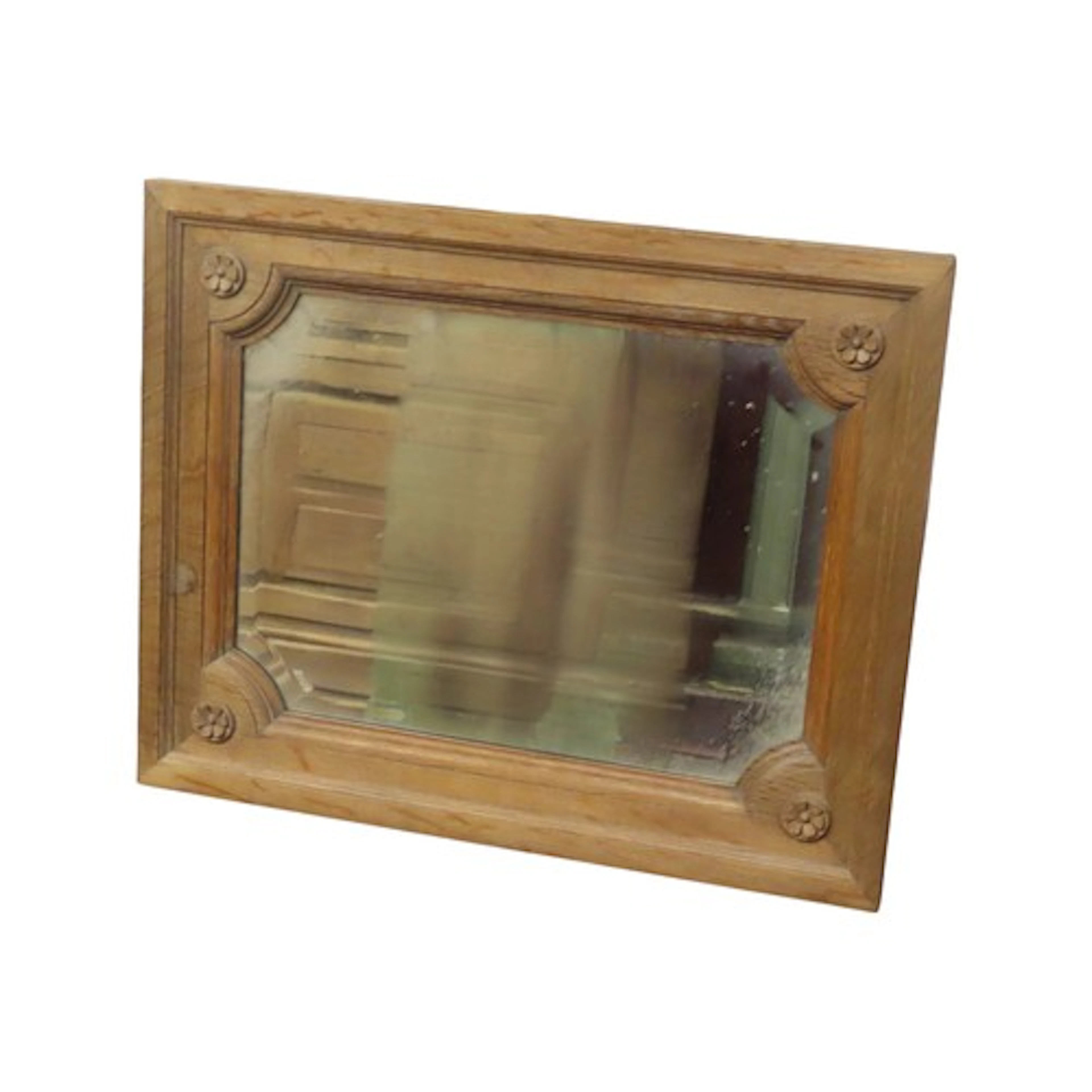 A rectangular stepped and moulded Oak framed wall mirror wit...