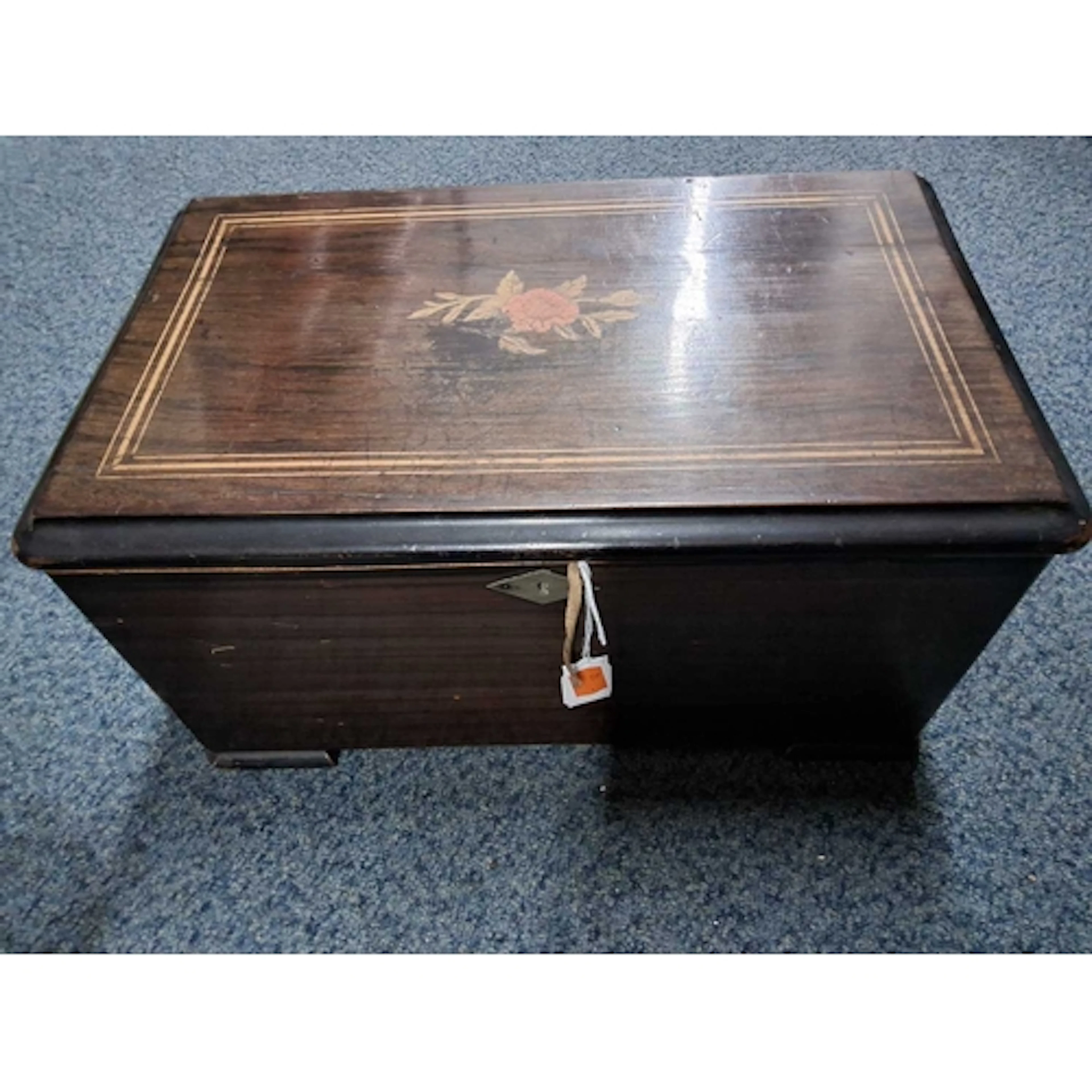 A 19TH CENTURY MUSIC BOX, the cover inlaid with a red rose, ...