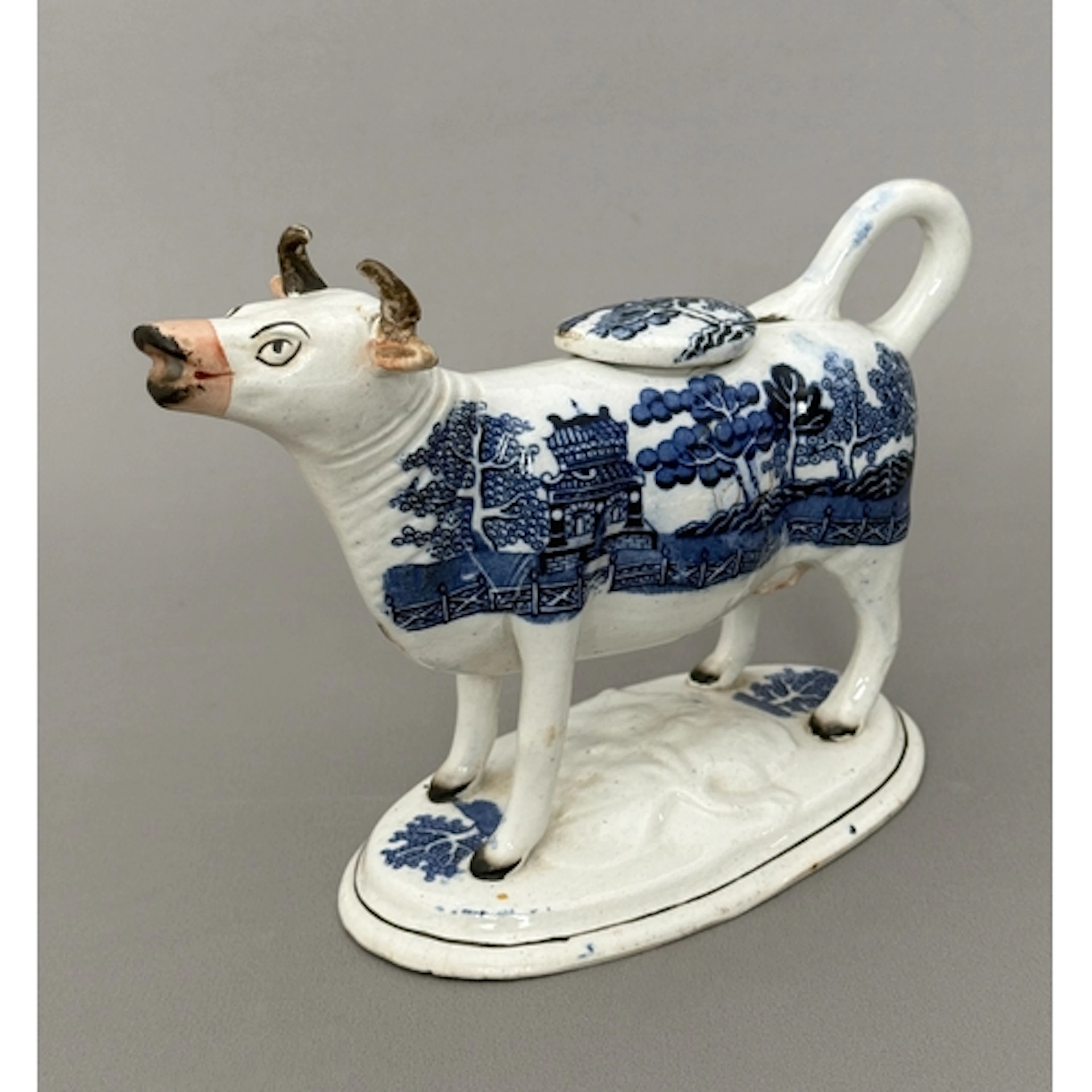 A 19th century Staffordshire pearlware blue and white cow cr...
