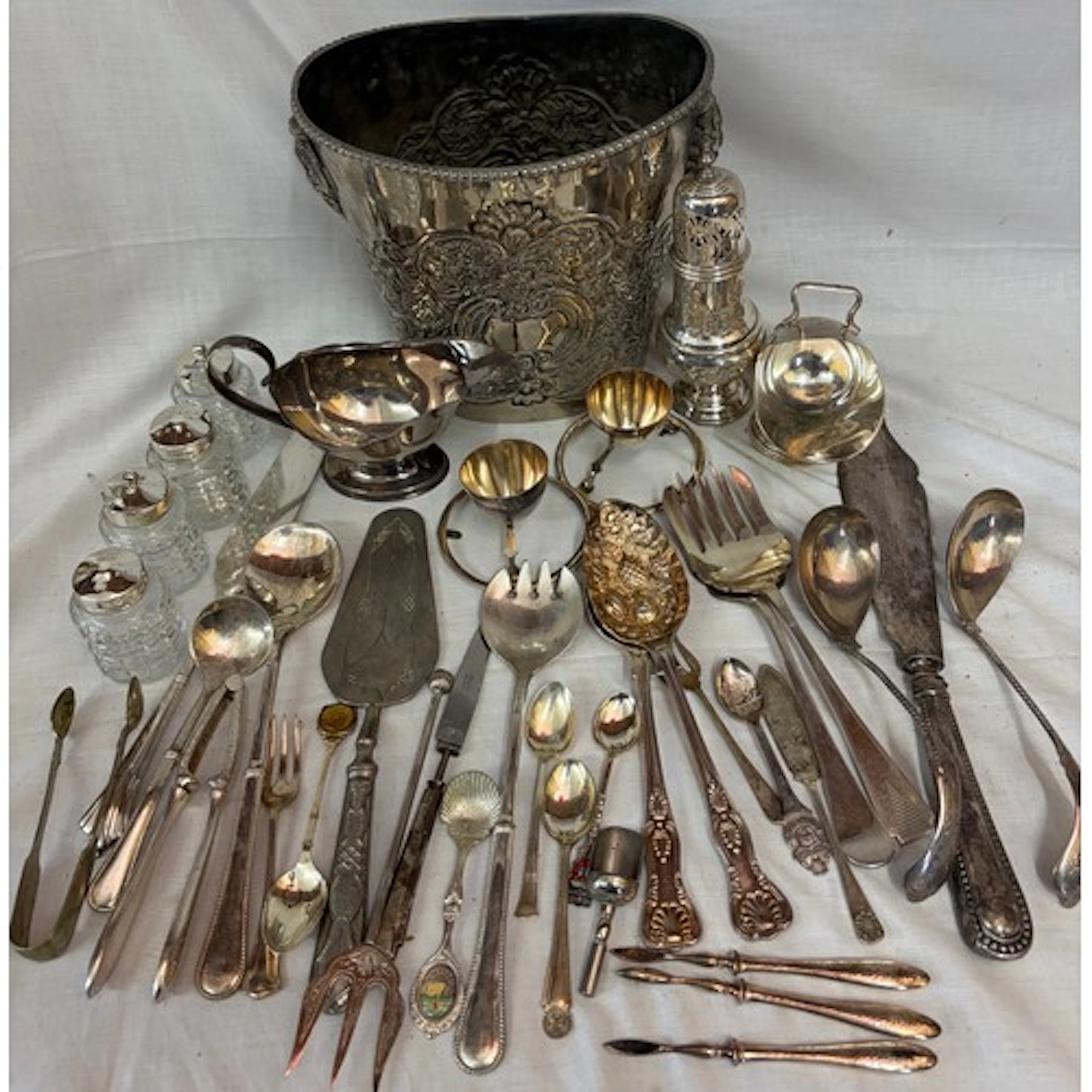 Silver plate to include wine cooler, sugar sifter, cruet set...