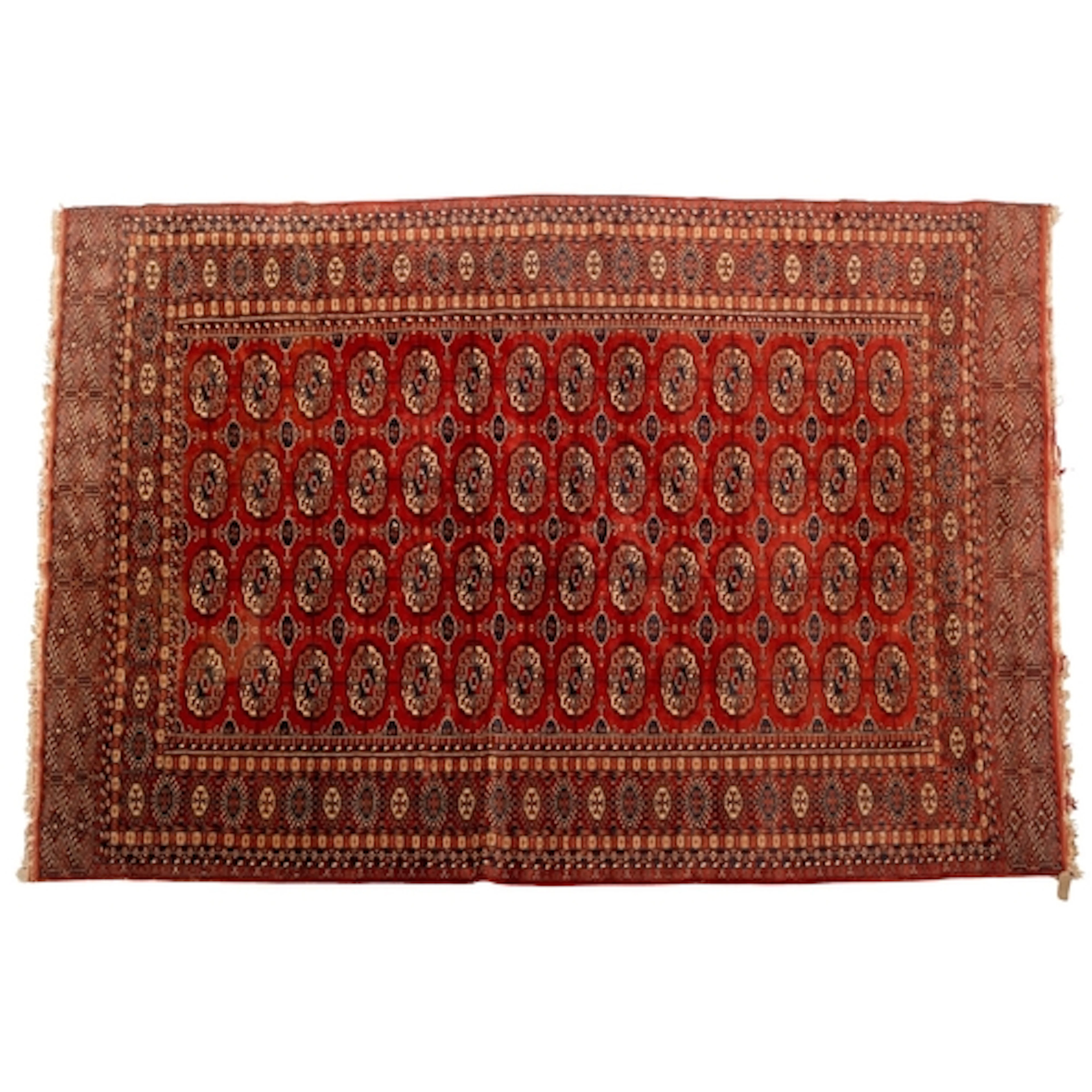 A Turkoman carpet, the tomato red field with four rows of qu...