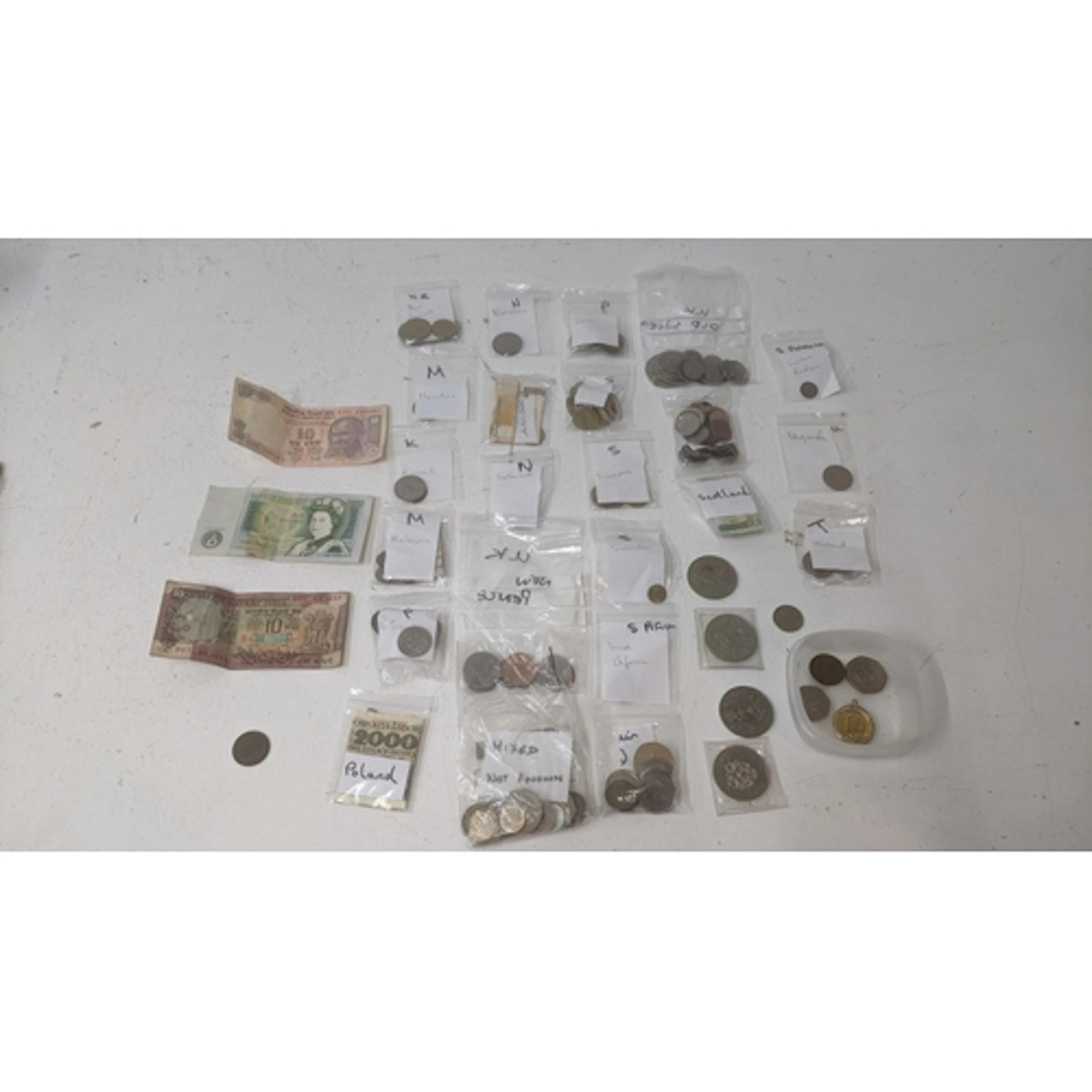 A collection of mid-20th century and later coins and banknot...