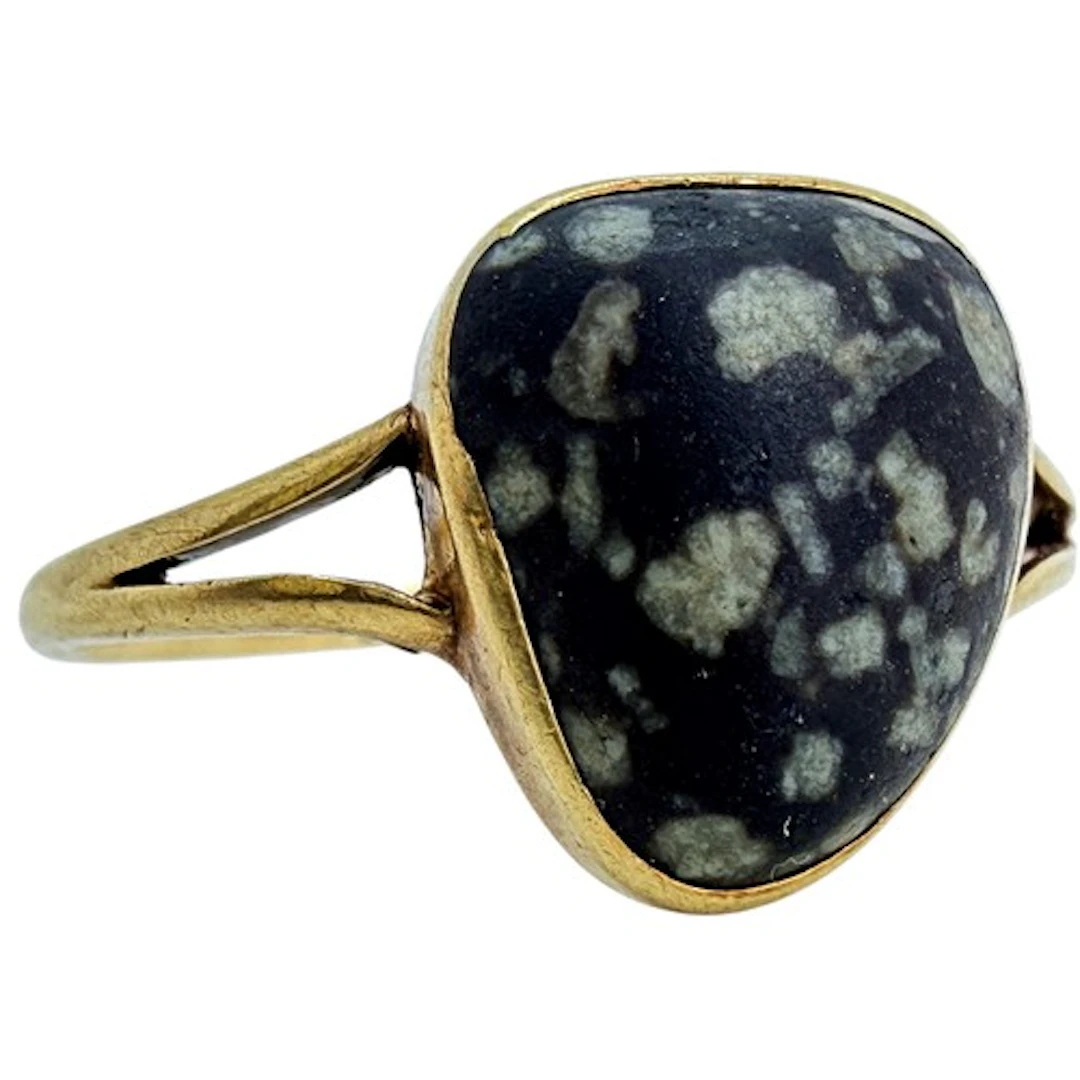 An unusual Victorian 15ct gold ring set with a large polishe...