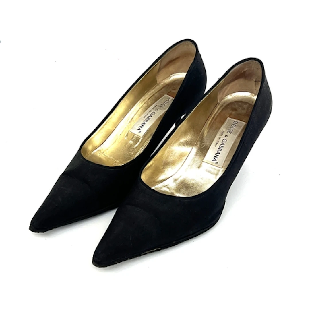 A pair of Dolce & Gabbana black silk and leather pointed toe...