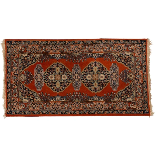 A Turkoman rug, the camel field with two rows of quartered g...