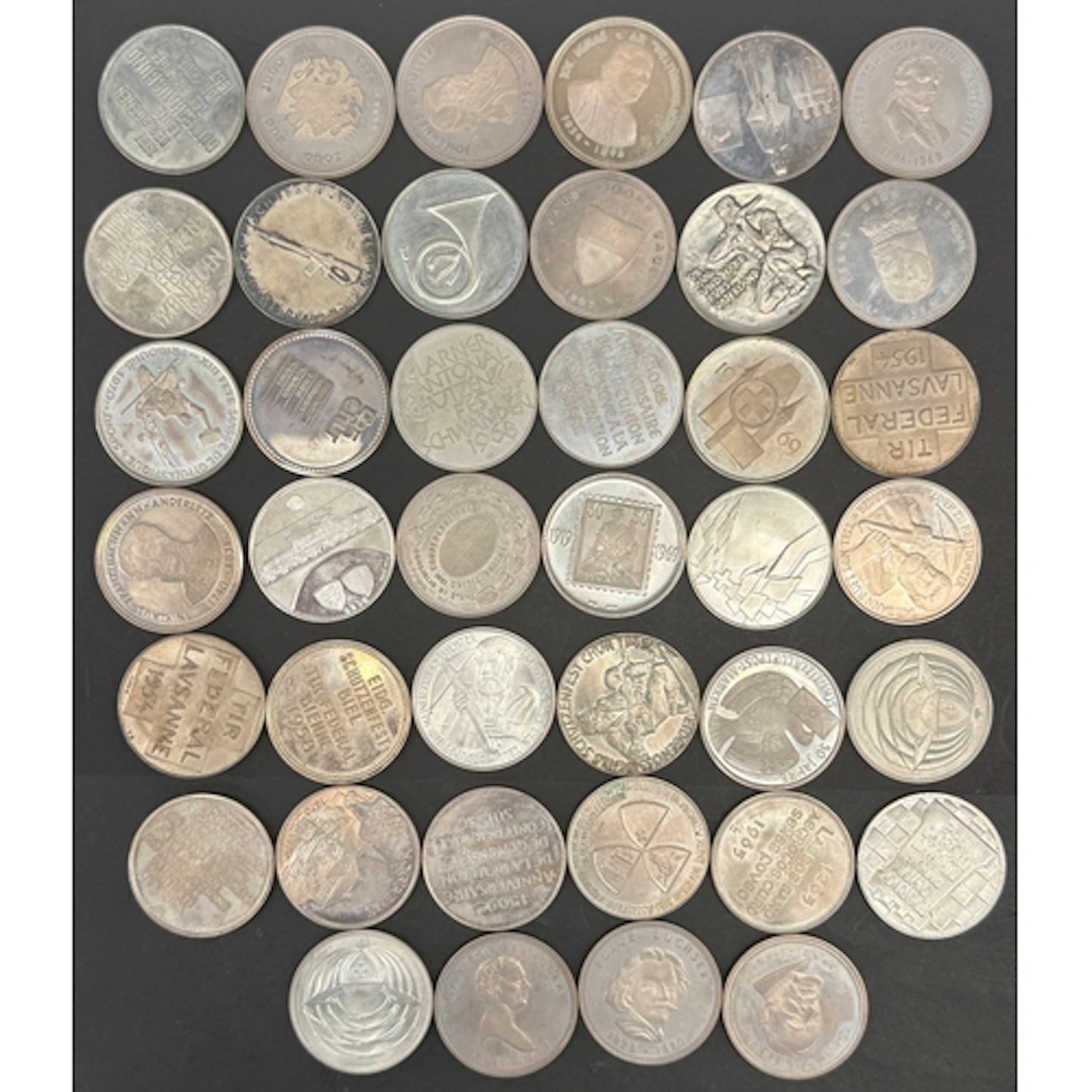A collection of 40 Swiss .900 silver commemorative medals, m...