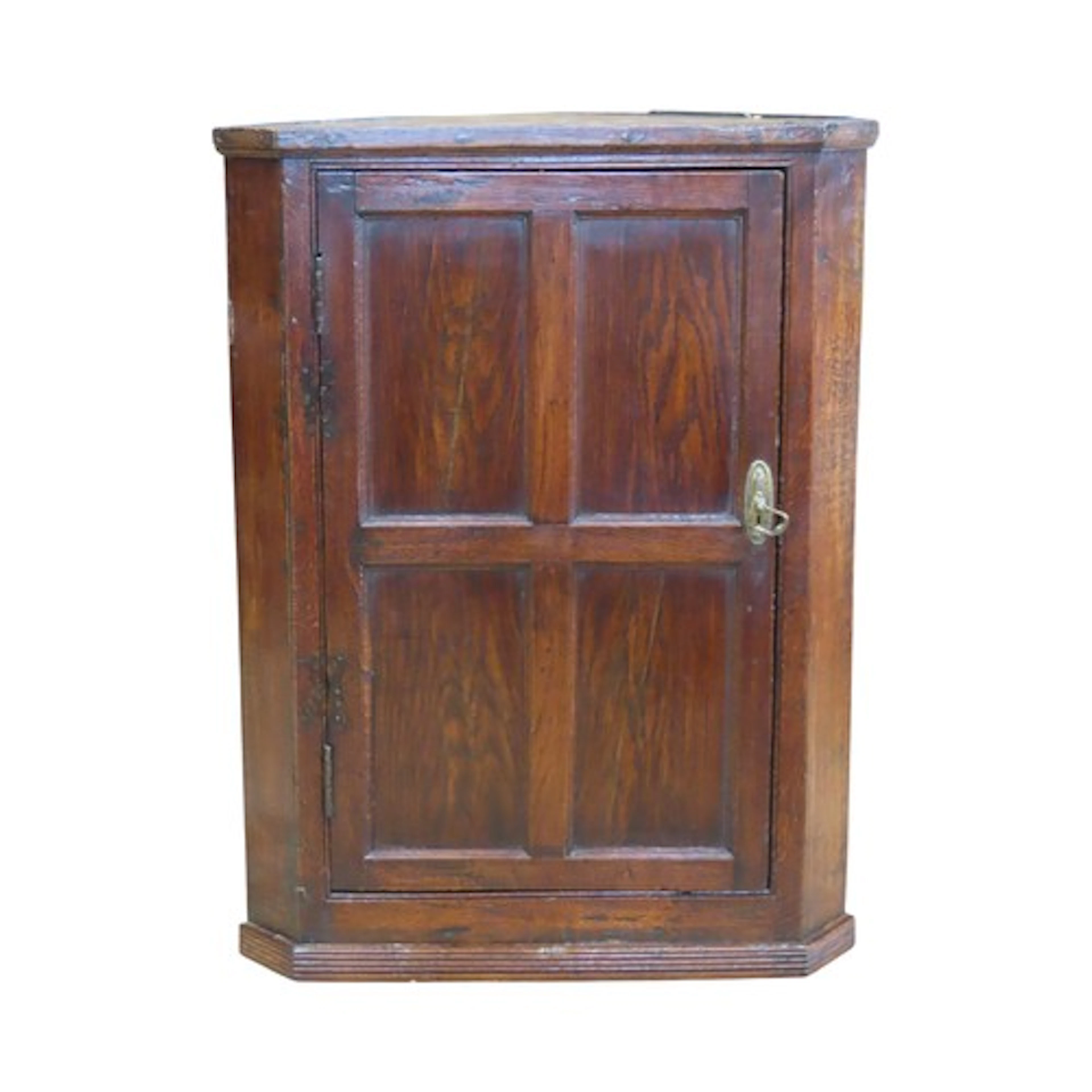 An antique oak country made hanging corner cupboard enclosed...
