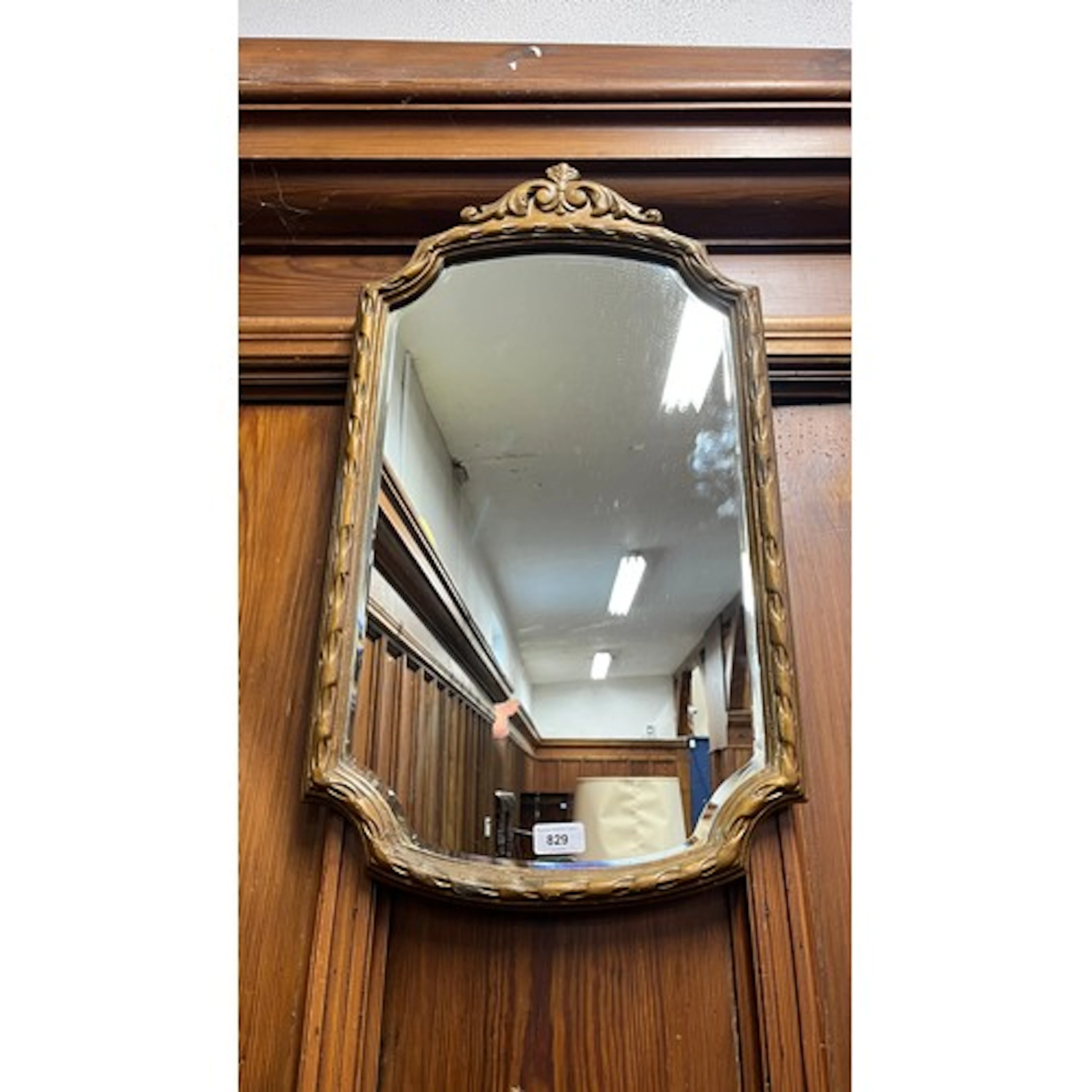 Shield shaped wall mirror, 69cm tall.