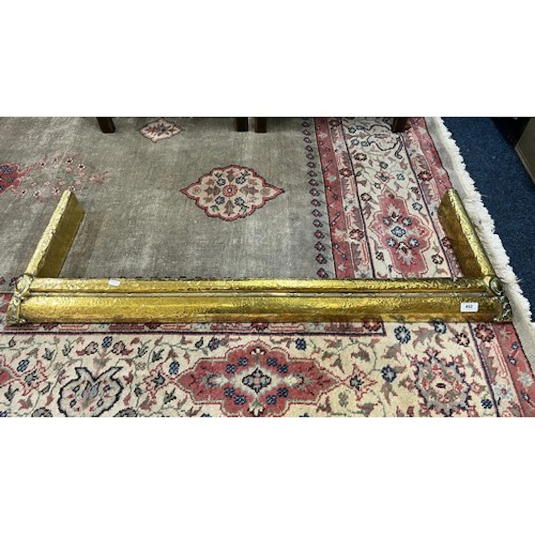 Brass art nouveau style fender, 117cm wide.