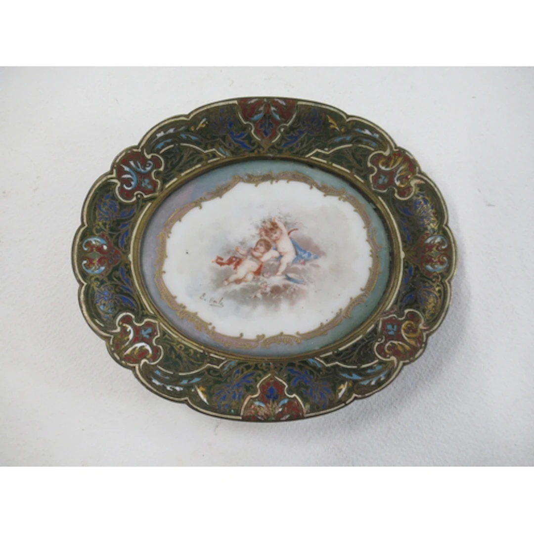 A shaped oval stand, inset with a porcelain panel decorated ...