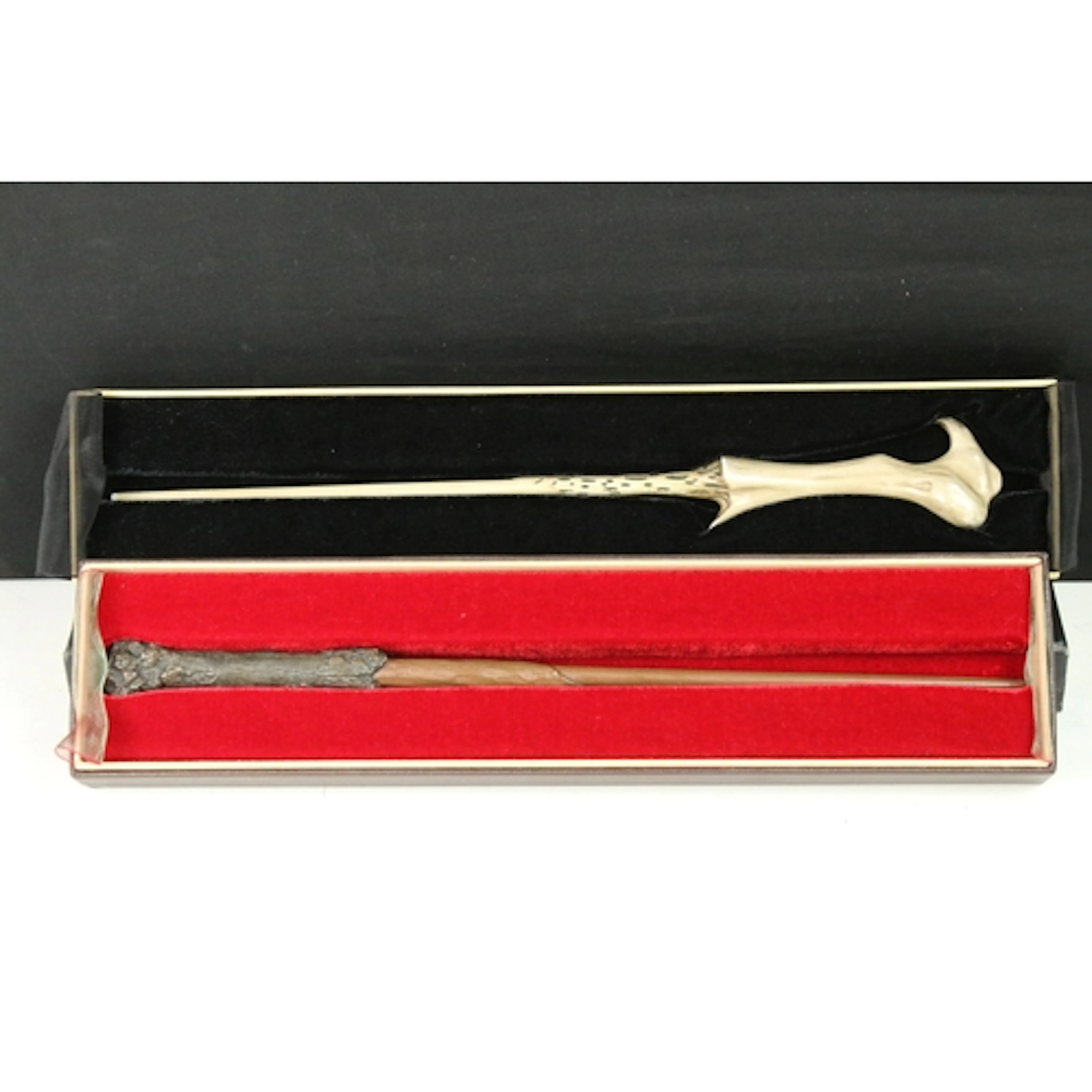 Two boxed Warner Bros Harry Potter wand prop replicas, with ...