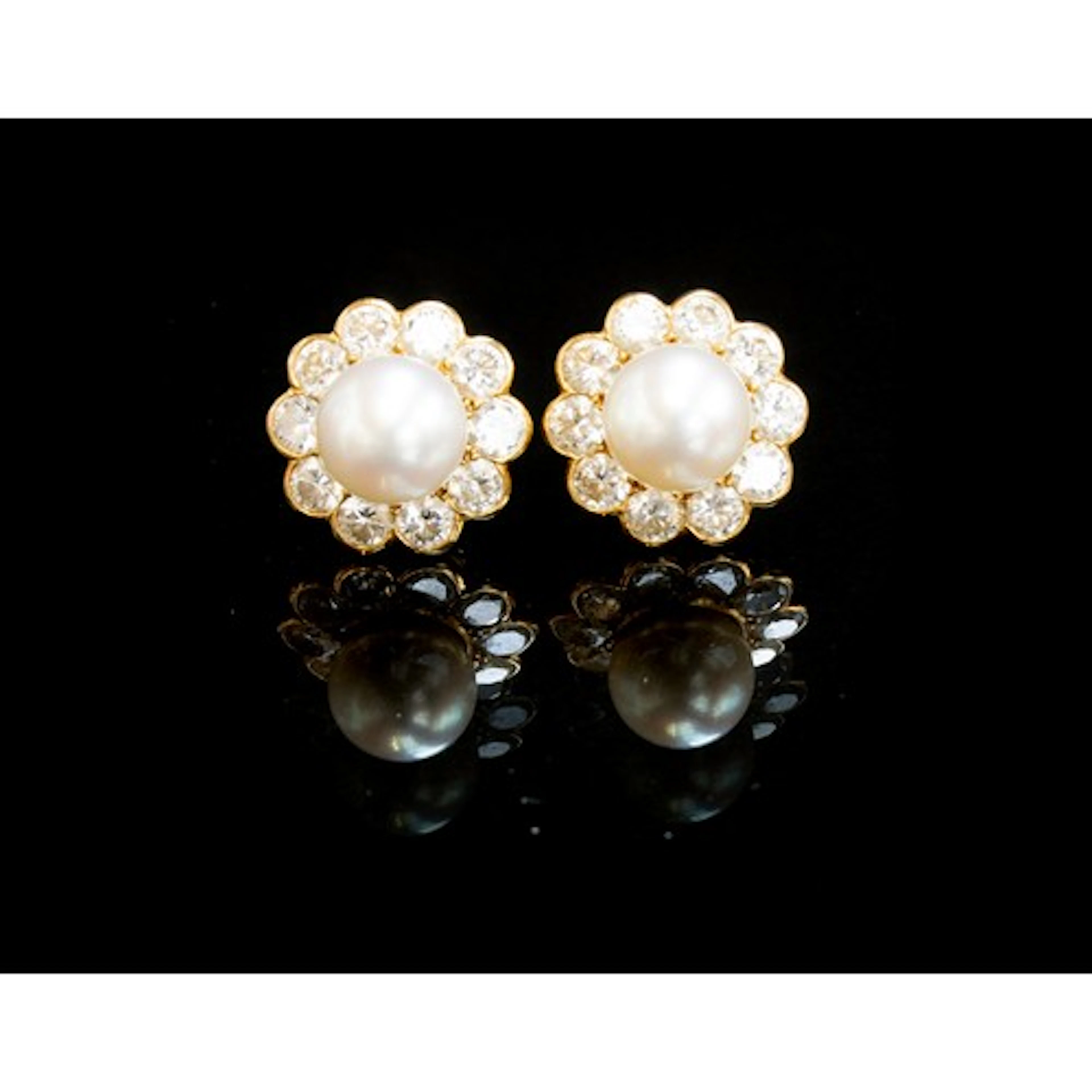 A pair of gold, pearl and diamond cluster stud earrings, unm...