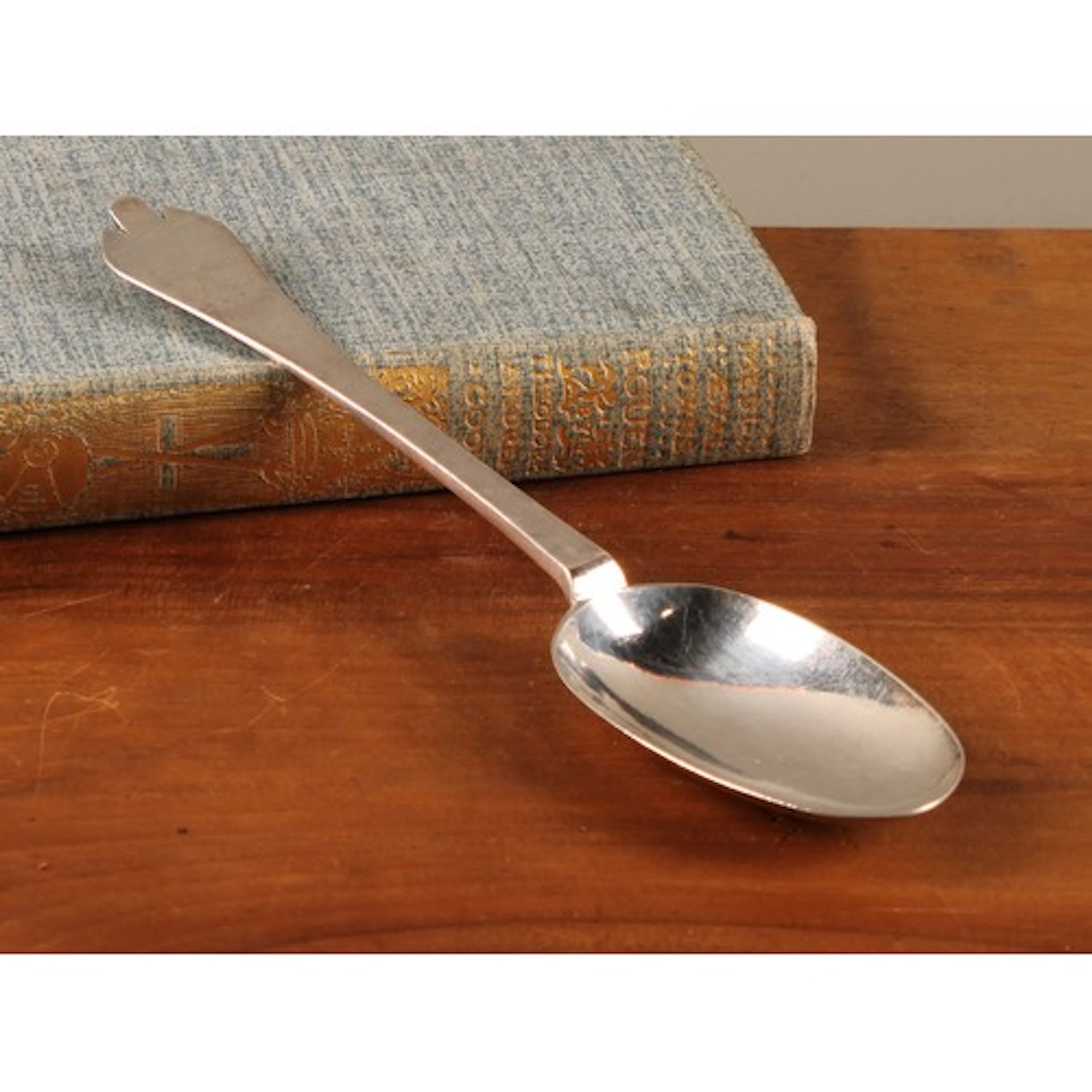 A William III/Queen Anne Britannia silver Trefid pattern spo...
