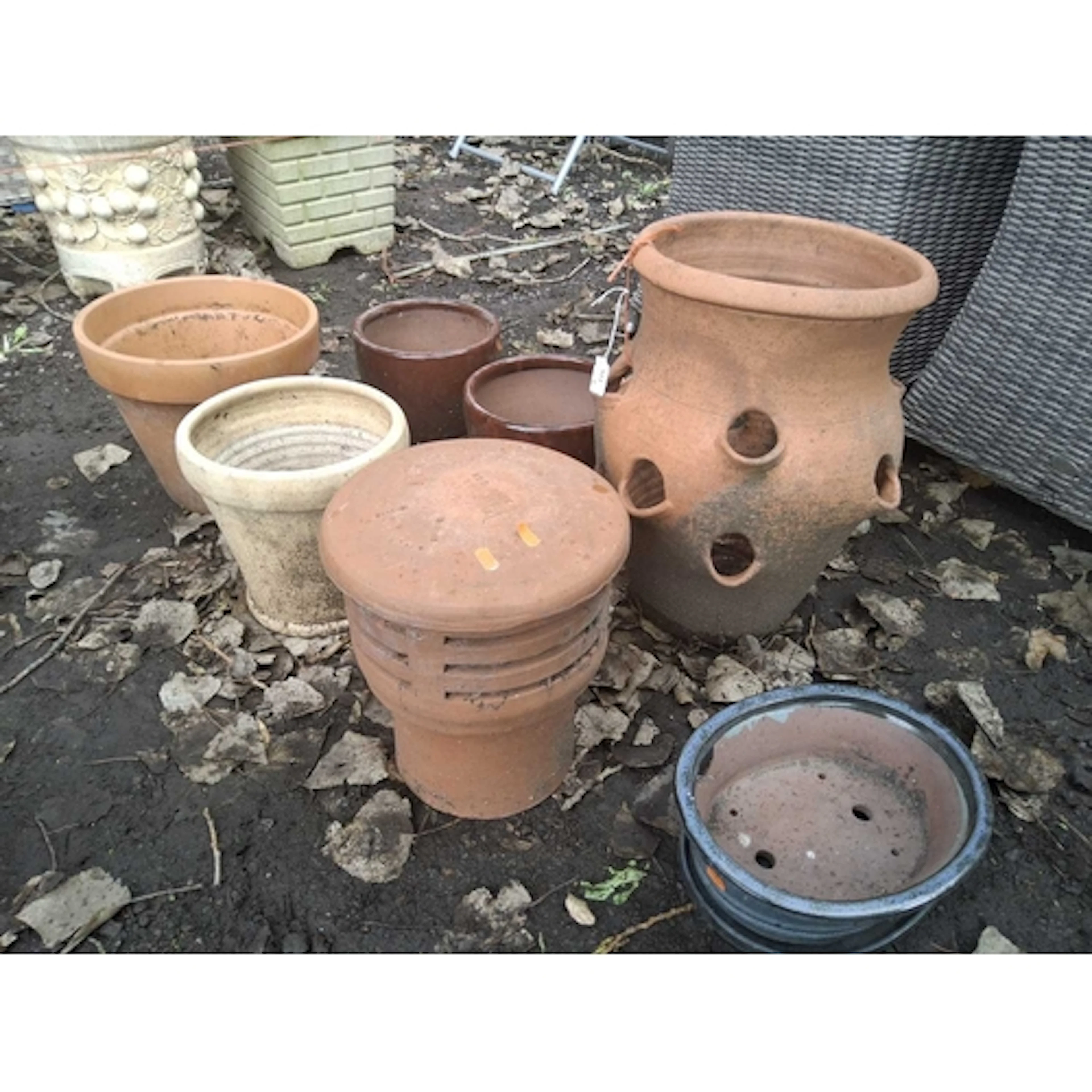 A SELECTION OF GARDEN PLANT POTS, to include a terracotta st...