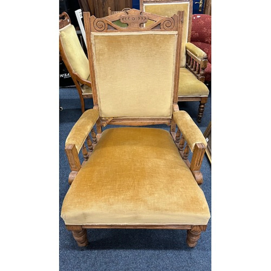 Antique oak framed parlour armchair, upholstered in yellow g...