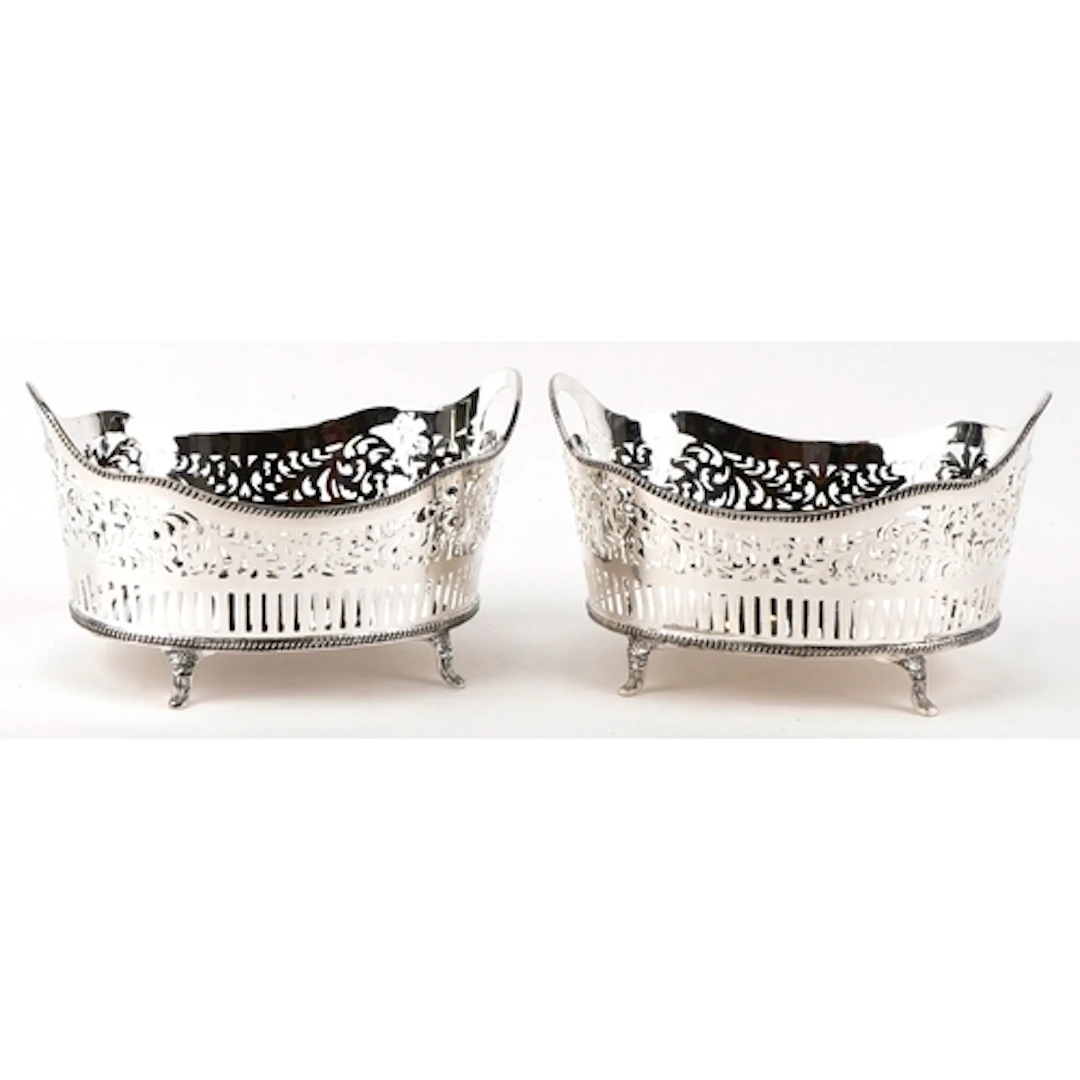 Pair of silver plated fruit baskets with twin handles, each ...