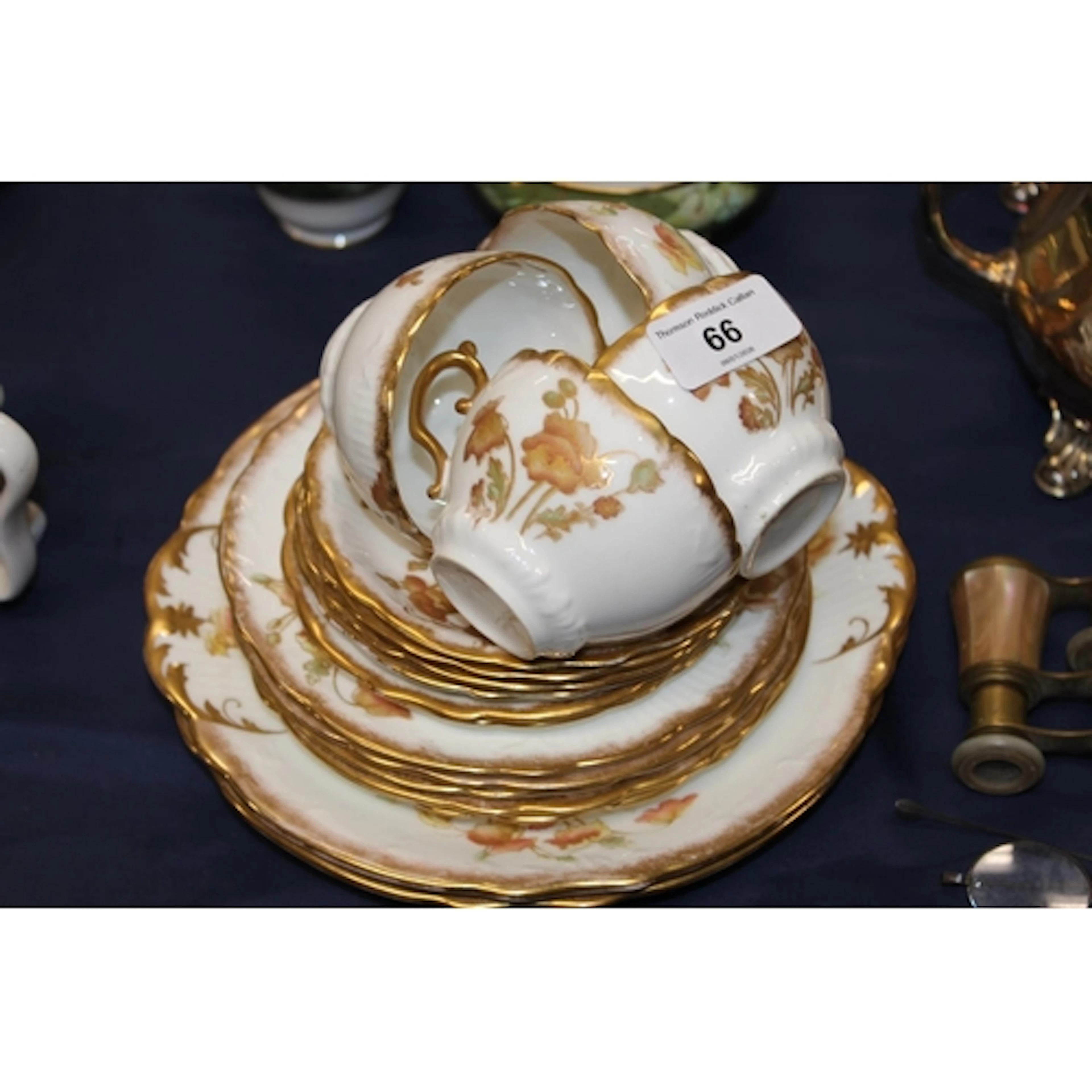 Nautilus style floral decorated part teaset comprising cups,...