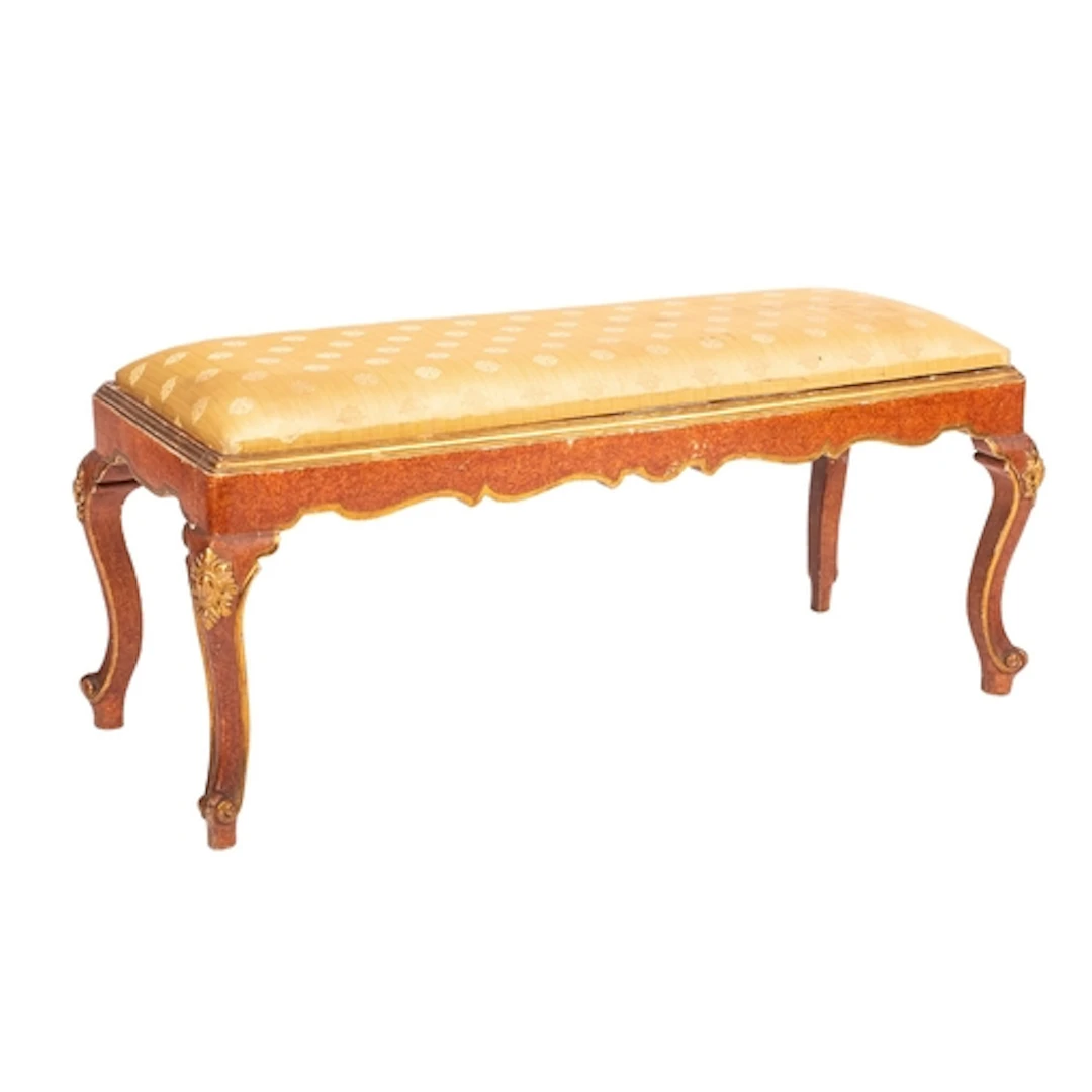 A carved, painted and parcel gilt wood long stool in Neopoli...