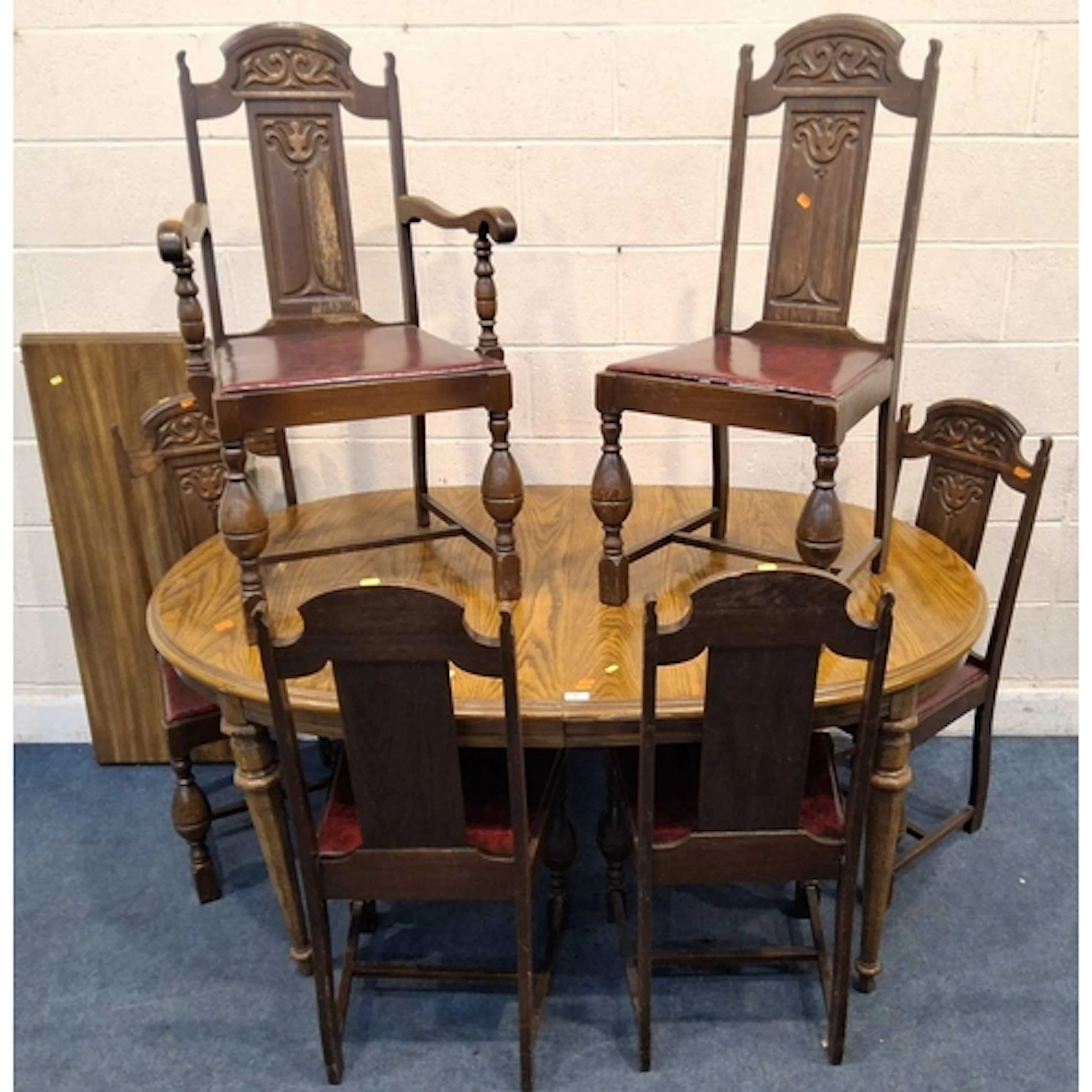 A 20TH CENTURY OAK EXTENDING DINING TABLE, with one addition...