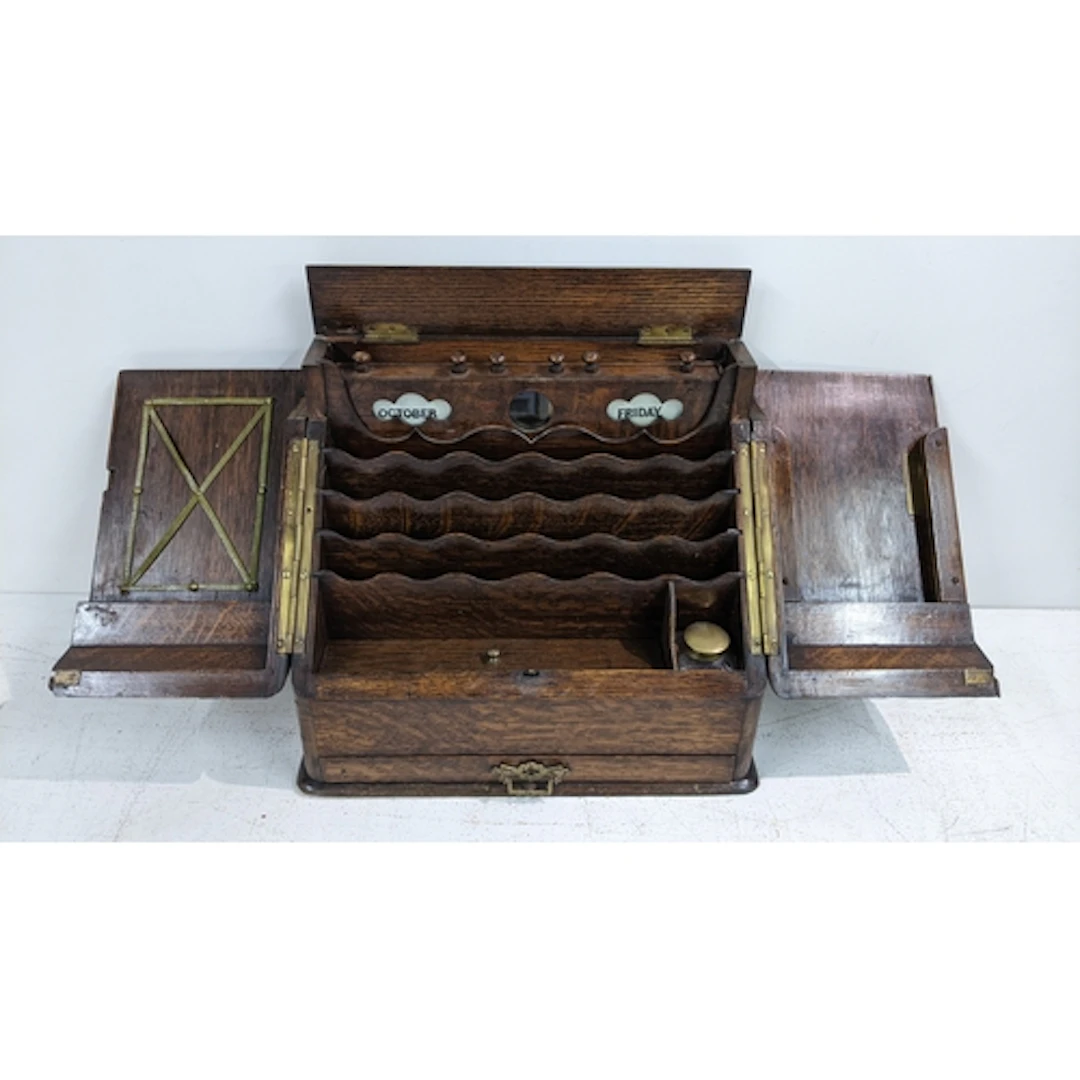 A Victorian oak desk top stationery cabinet having twin door...